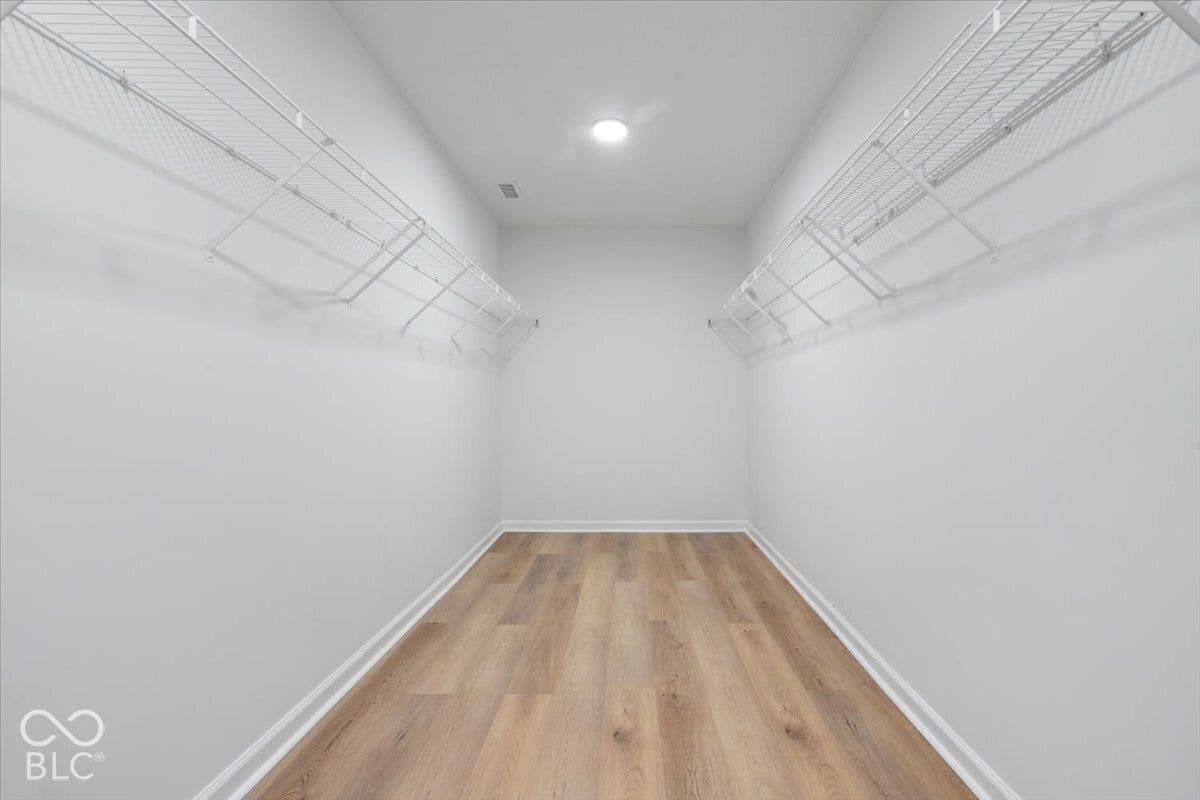 11780 Copper Mines Way, Fishers, IN 46038 Walk-in closet with wood-finish flooring, recessed lighting, and white wire shelving