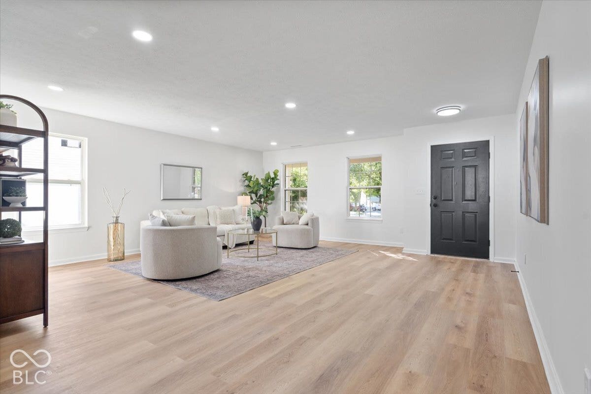 11780 Copper Mines Way, Fishers, IN 46038 Bright interior space with light wood-finish flooring, recessed lighting, and white walls