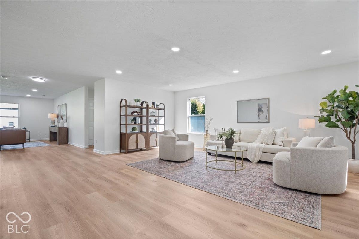 11780 Copper Mines Way, Fishers, IN 46038 Recessed lighting, wood-finish flooring, white wall finishes, and multiple windows