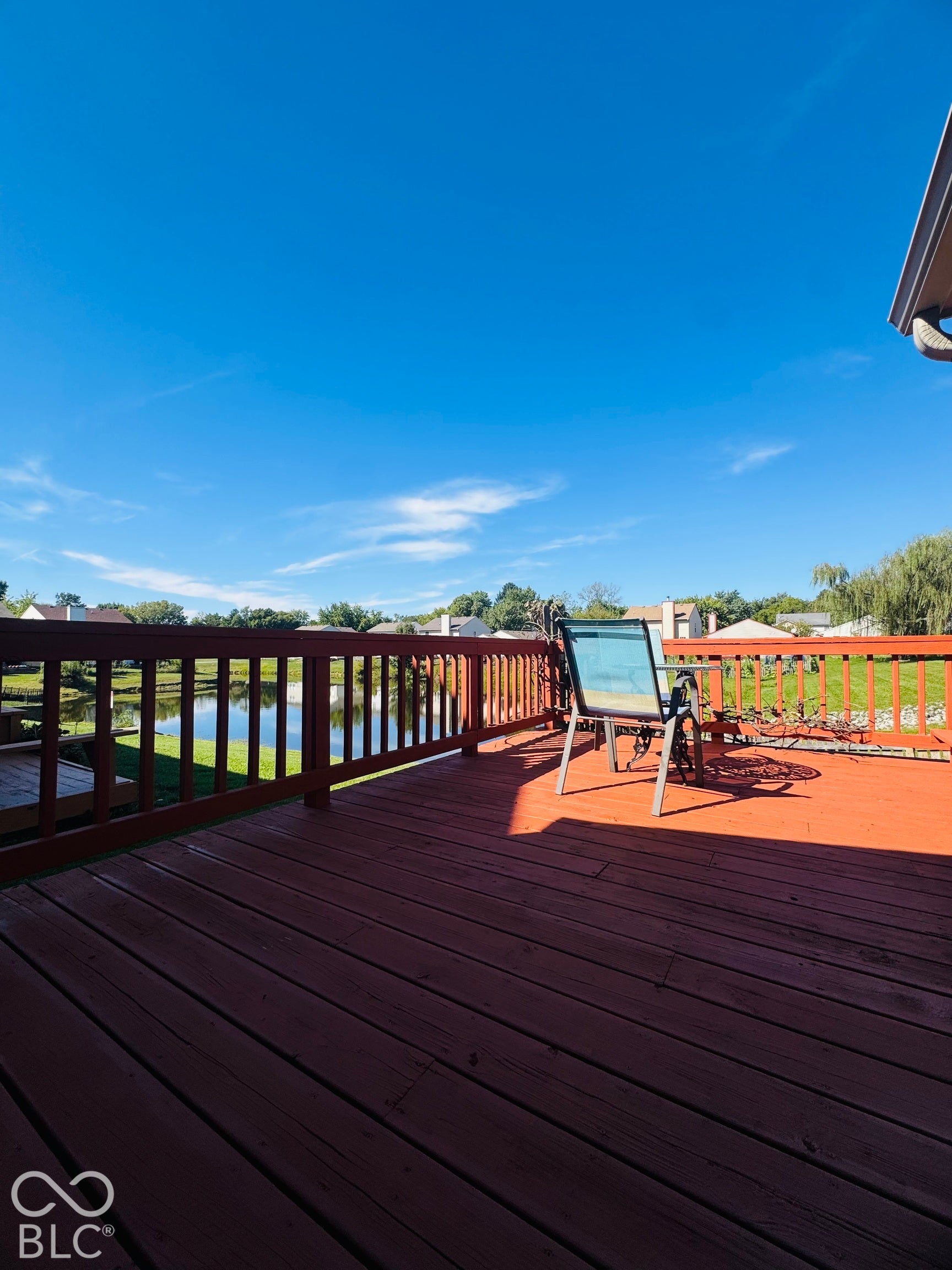 Spacious wood deck with perimeter railing