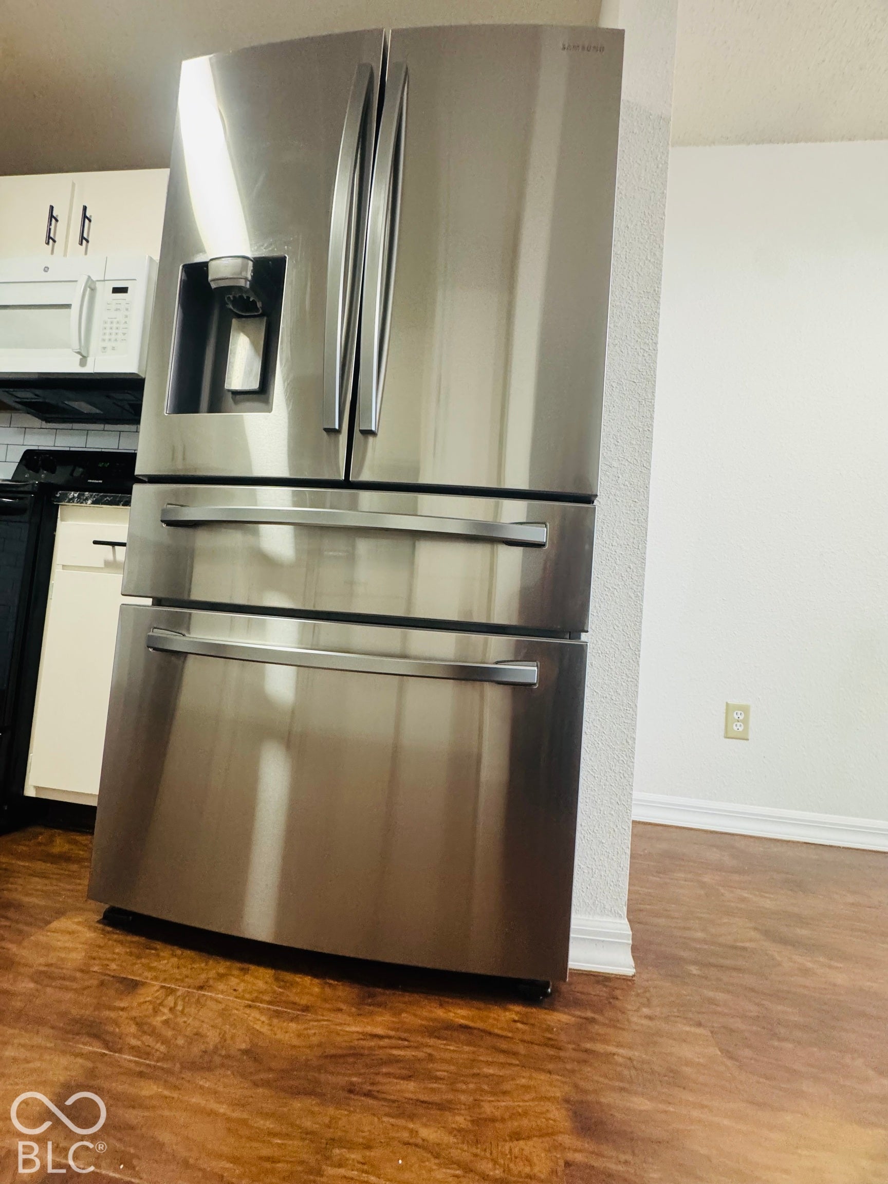 Stainless steel French door refrigerator with bottom freezer