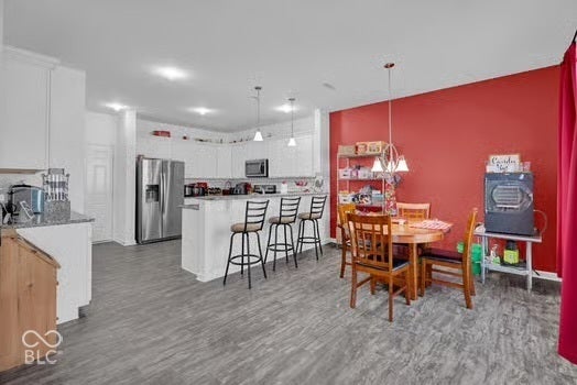 White cabinetry with stainless steel appliances