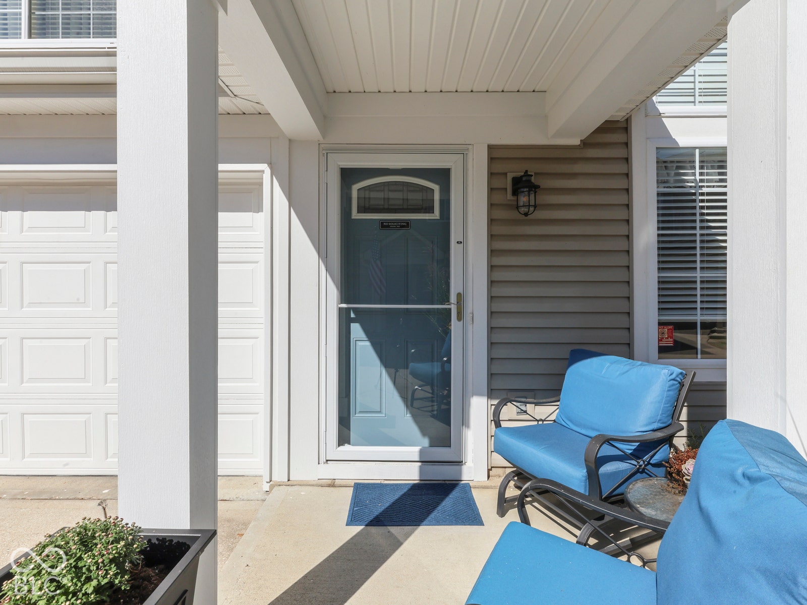 Covered front porch offers a warm welcome home.