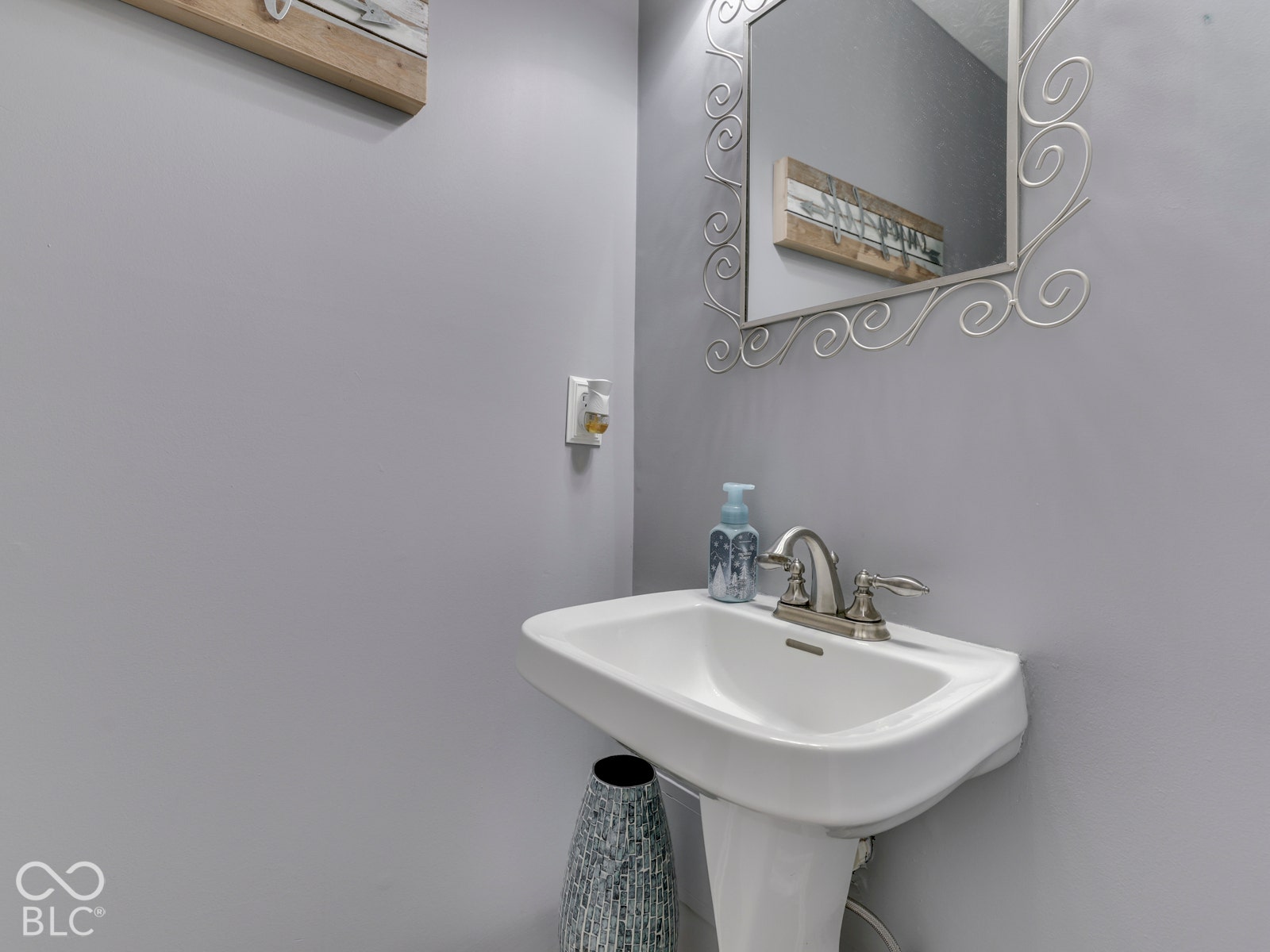 Half bath on main level with pedestal sink