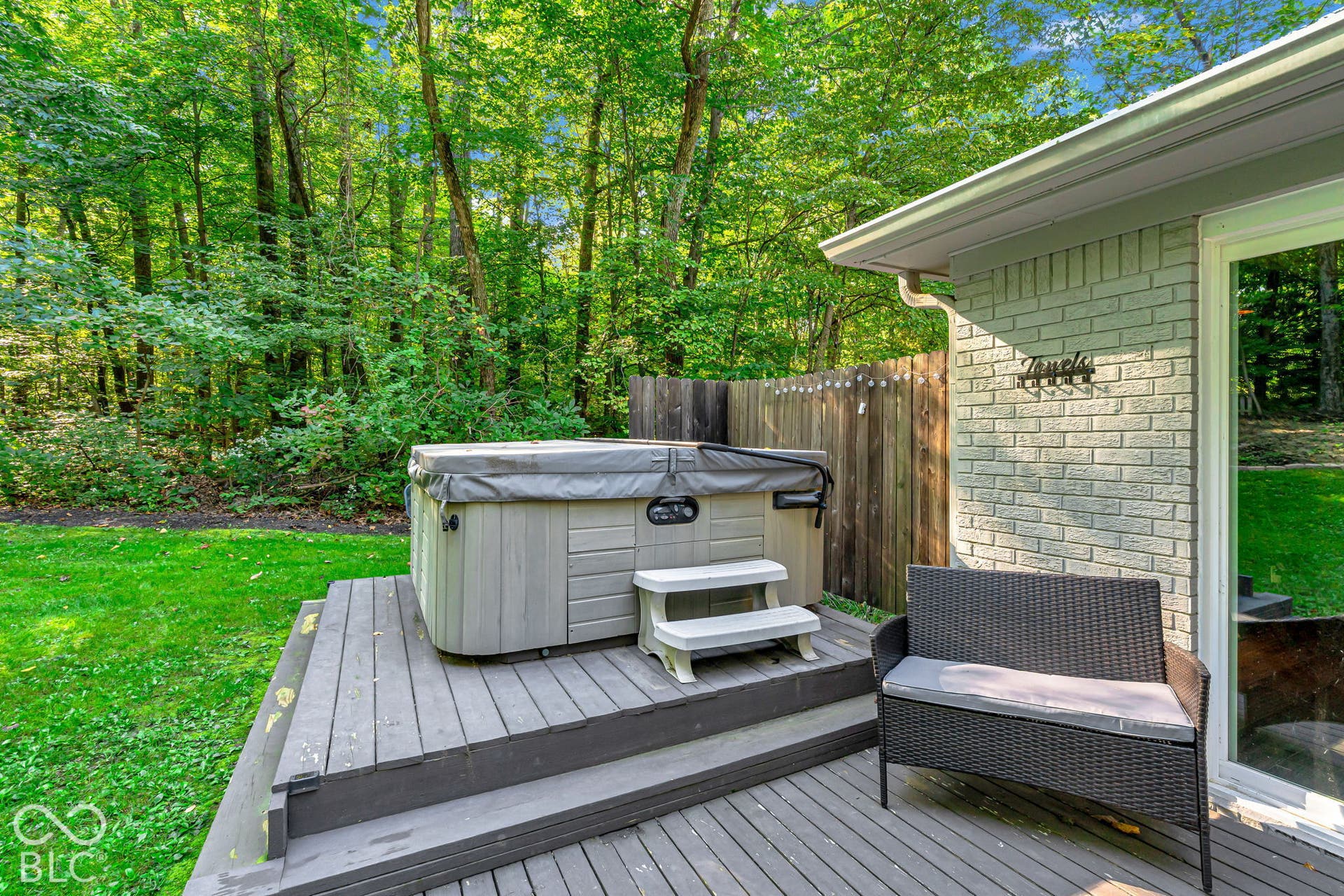 Wood-finish deck with built-in hot tub