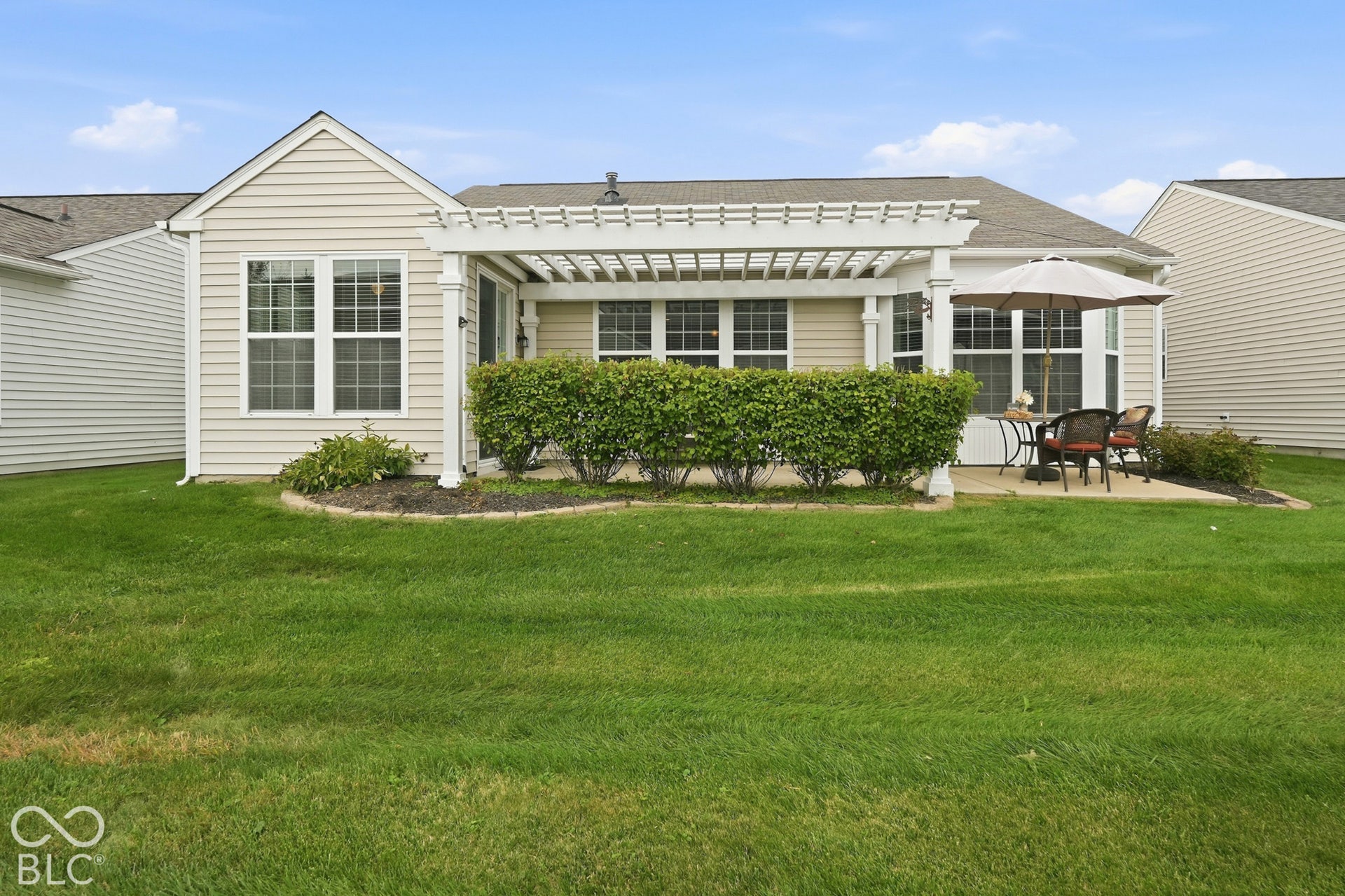The thoughtful landscaping makes the patio private for your morning coffee.