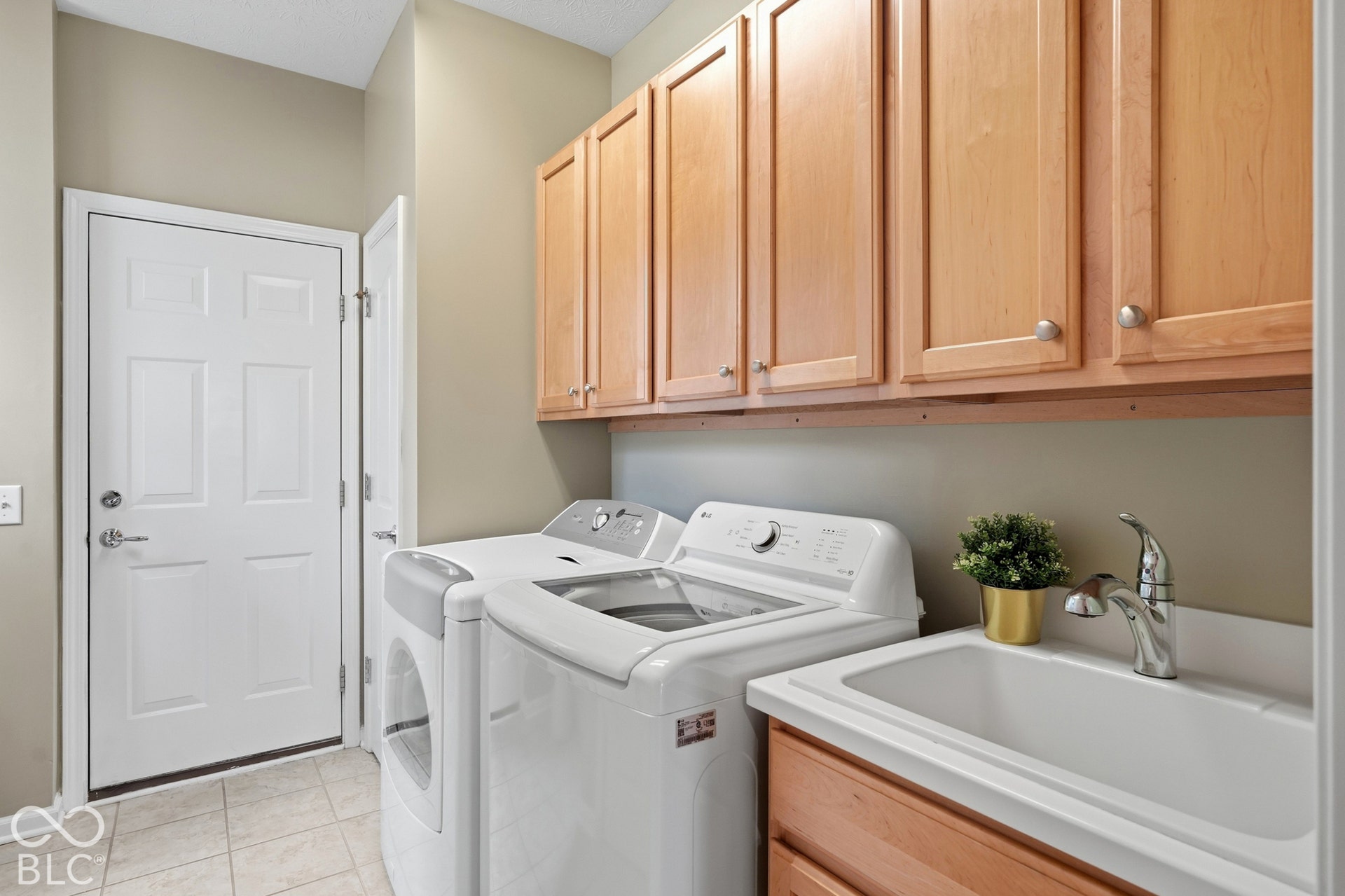 On the way to the large garage is the newly painted laundry room, the washer & dryer are included!