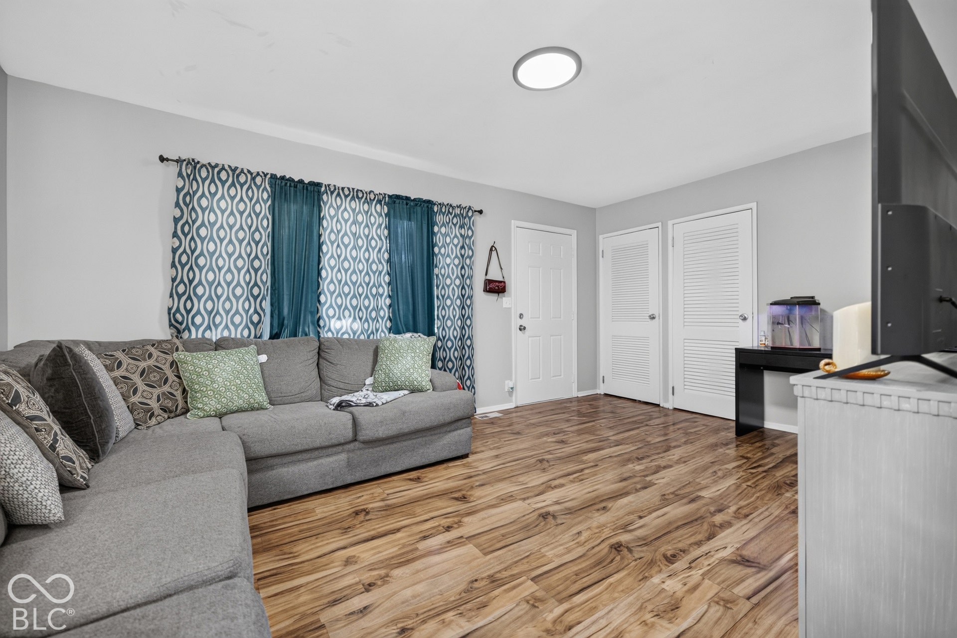 3241 Winton Avenue, Indianapolis, IN 46224 Wood-finish flooring, light grey wall paint, and white trim throughout