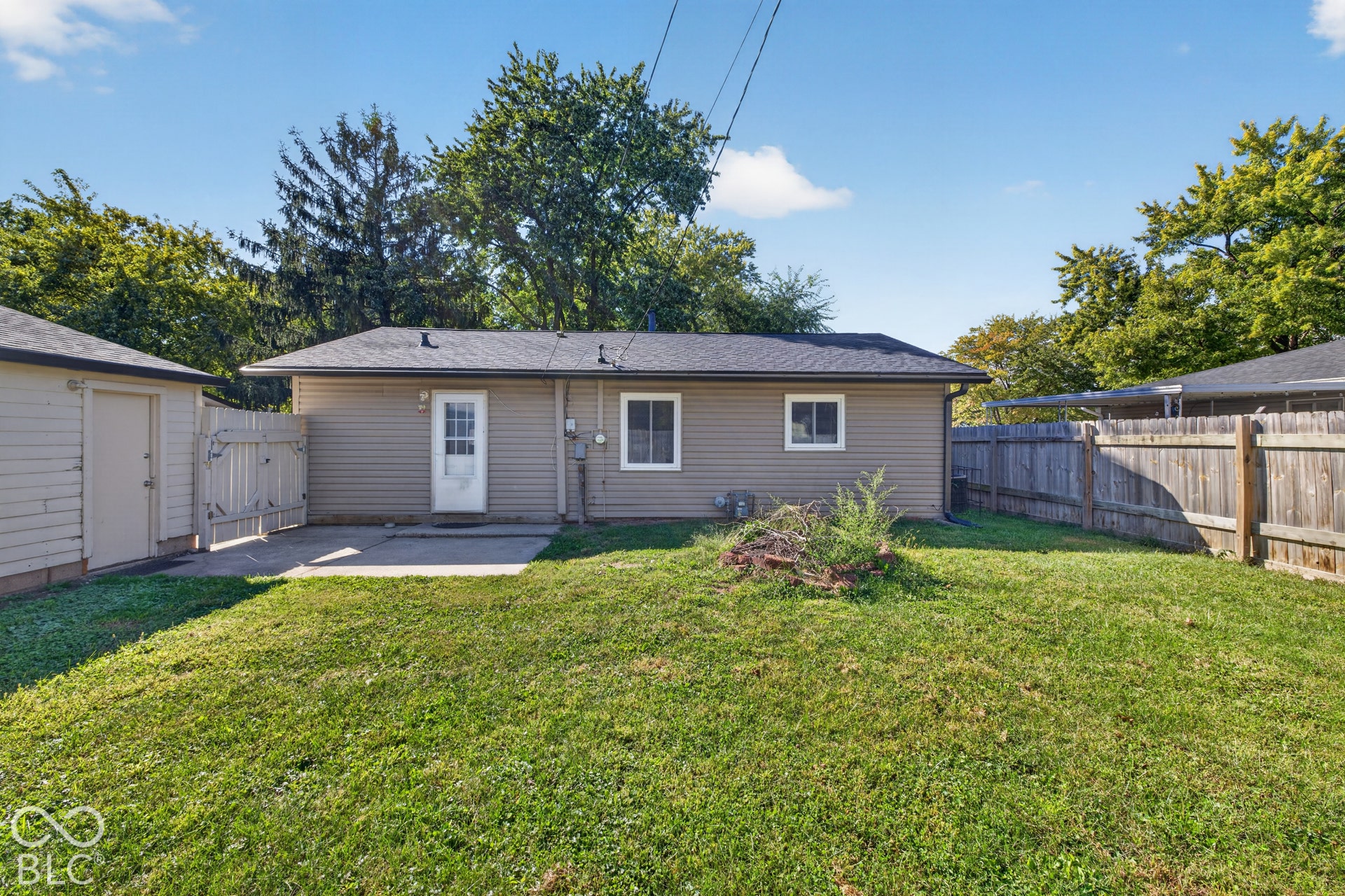 3241 Winton Avenue, Indianapolis, IN 46224 Spacious single-story residence with vinyl siding and multiple windows offering natural light
