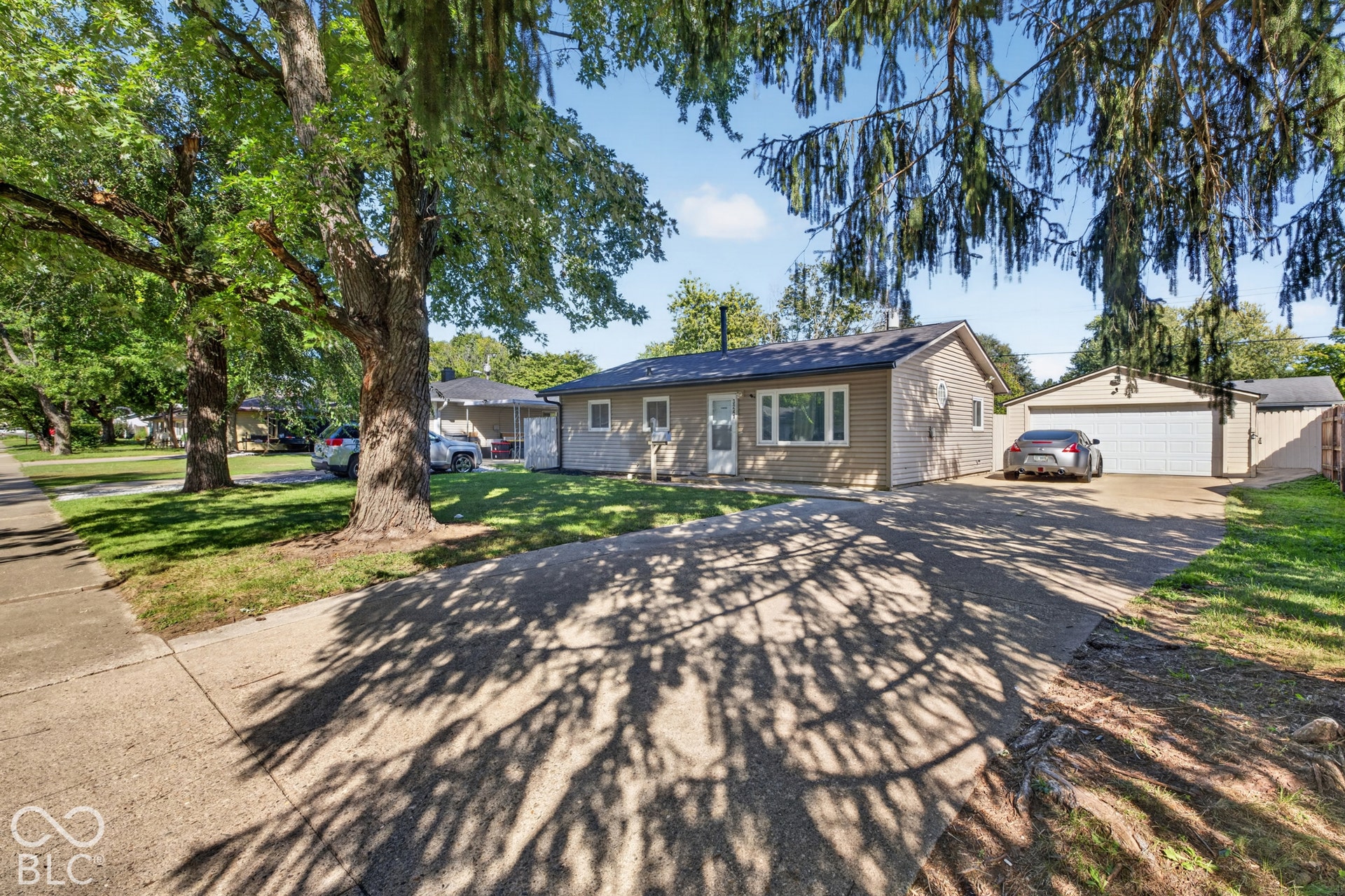 3241 Winton Avenue, Indianapolis, IN 46224 Single-story residence featuring light-colored siding and a dark-shingle roof