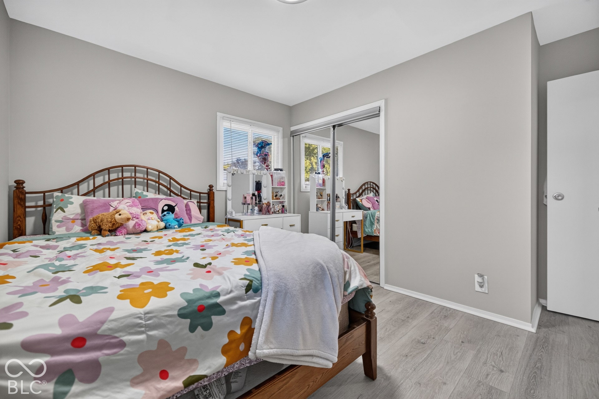 3241 Winton Avenue, Indianapolis, IN 46224 Light gray wall paint, wood-finish flooring, sliding mirrored closet doors, and recessed lighting