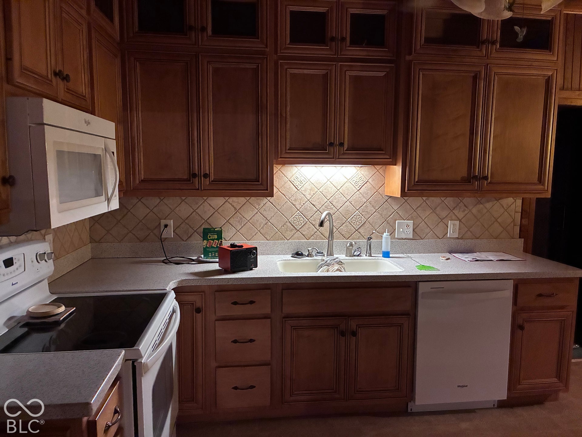 Wood-finish cabinetry paired with light-toned countertops