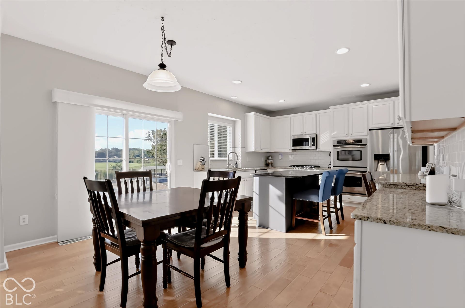 Eat-in kitchen & island seating give multiple dining options in addition to the formal dining room