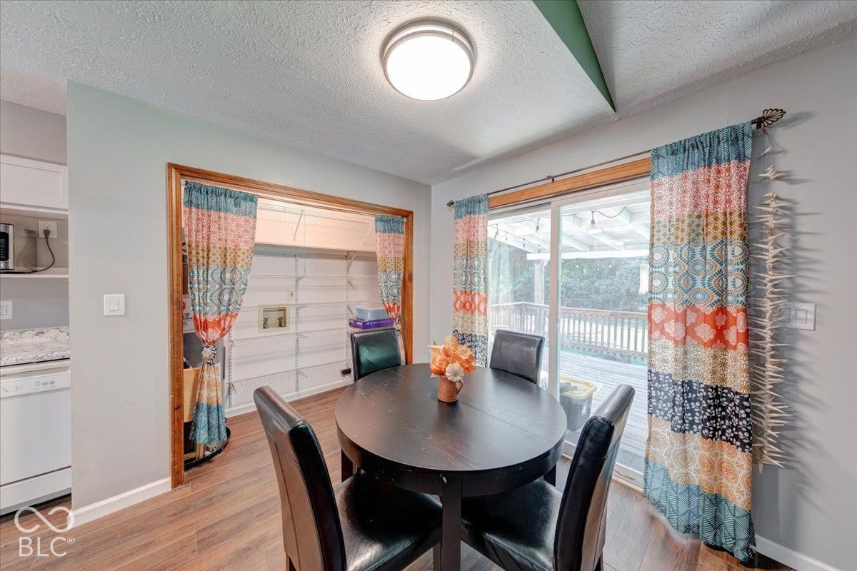 Dining nook with pantry and patio door leading to back deck