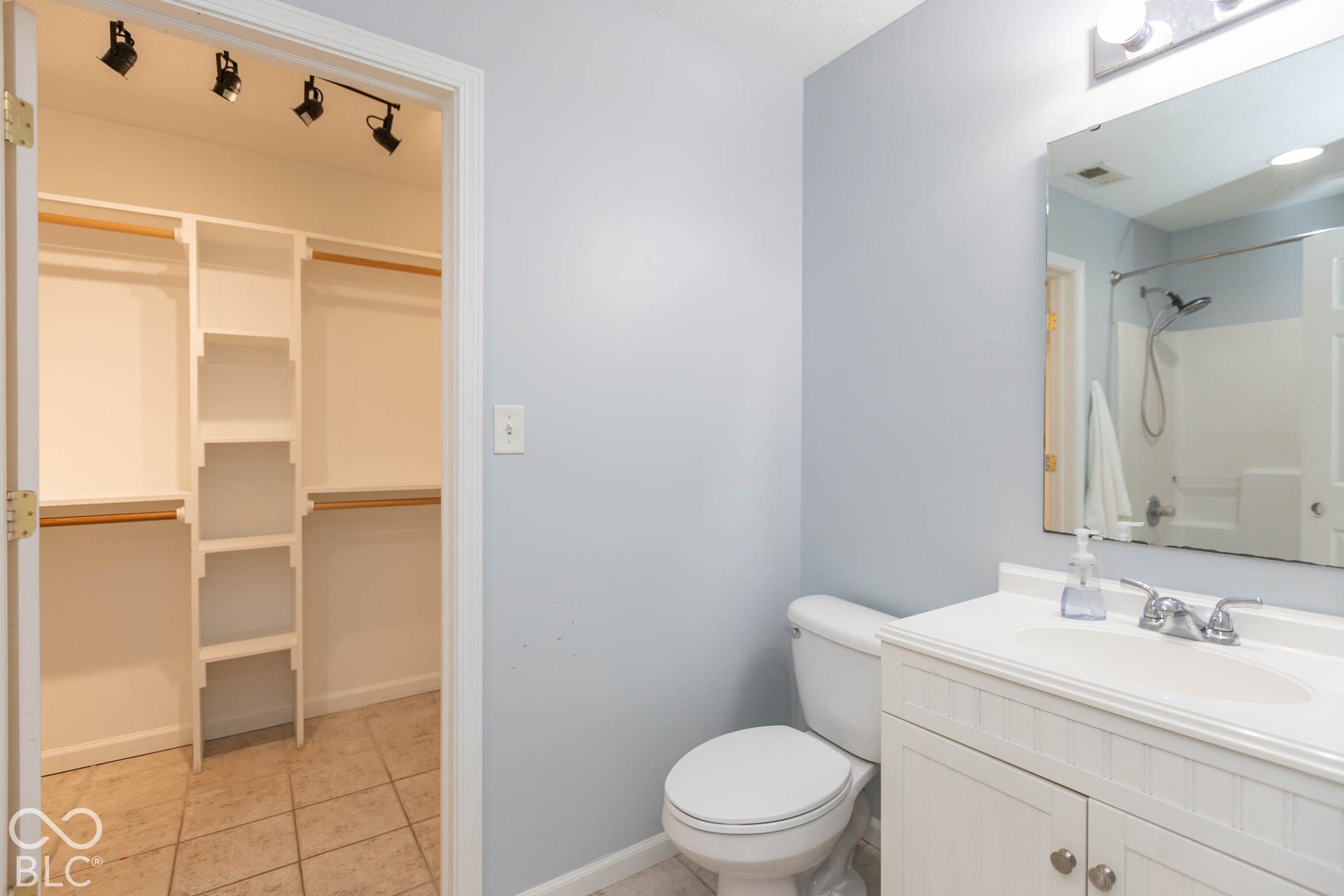 primary bath with walk in closet