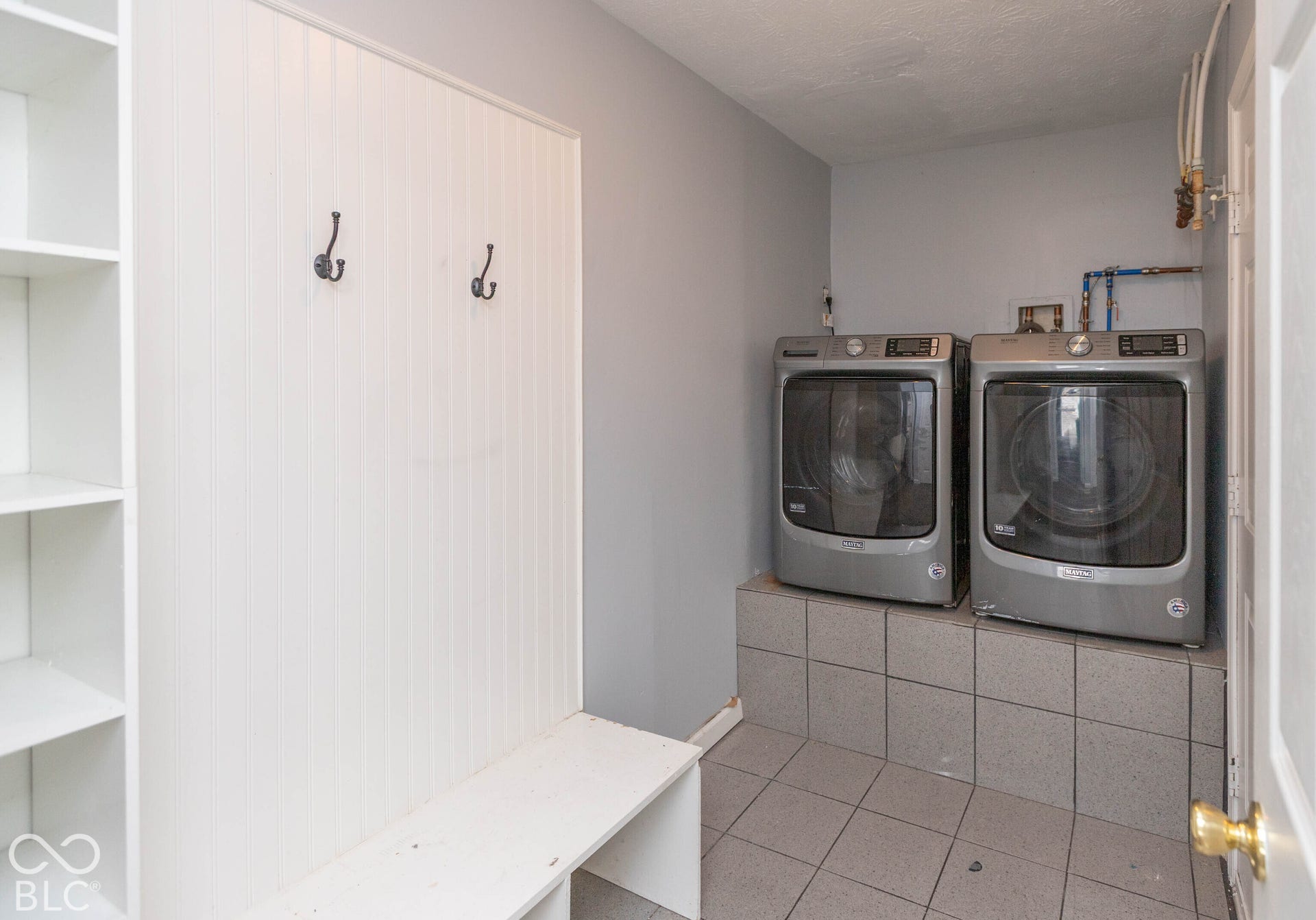 laundry/mud room with built-ins and W/D stays