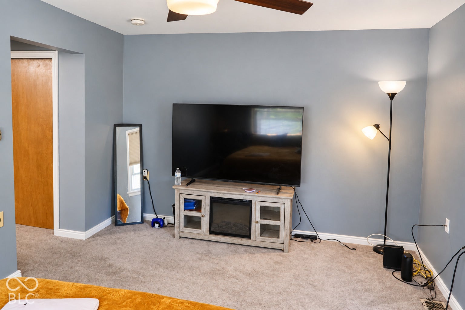 3566 Watson Road, Indianapolis, IN 46205 Textured gray carpeting, neutral wall paint, and a ceiling fan with integrated lighting