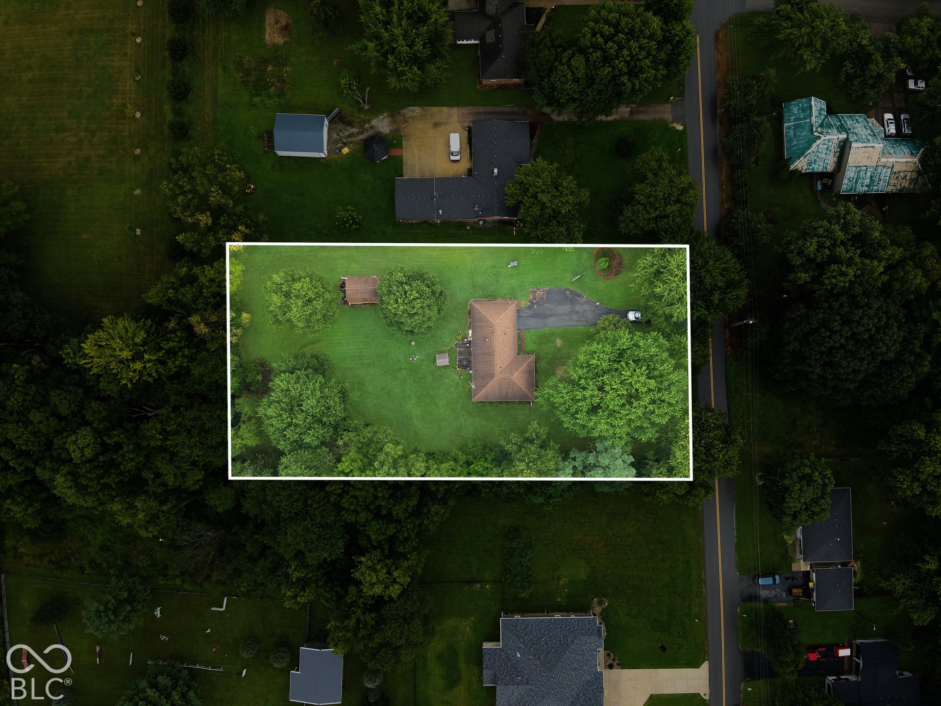 Virtually Altered - Expansive green lawn, mature trees, and a detached shed