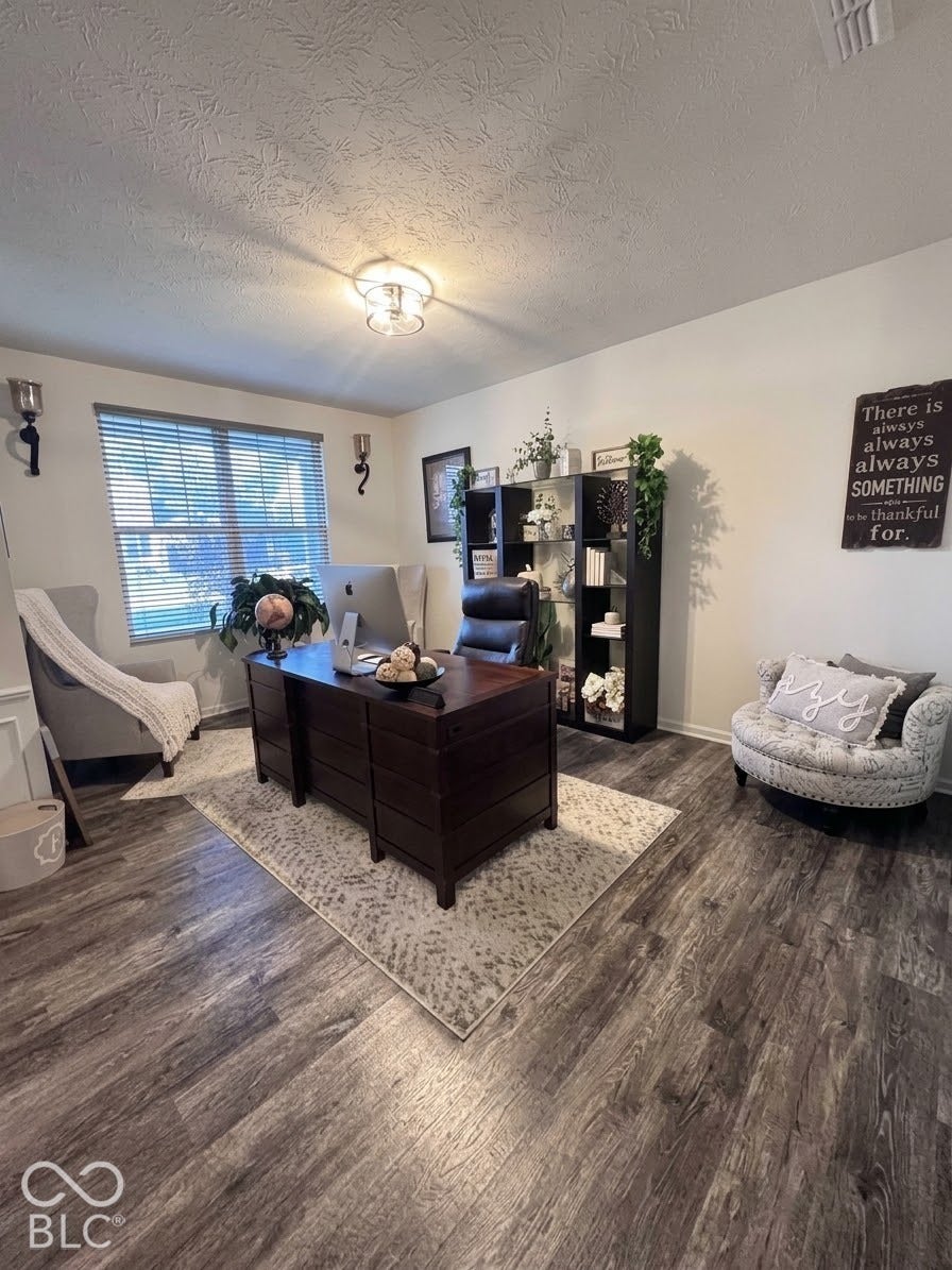Wood-finish flooring throughout the space