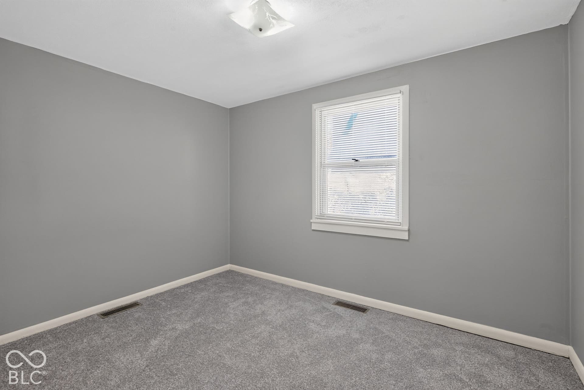 Neutral gray wall paint with white trim