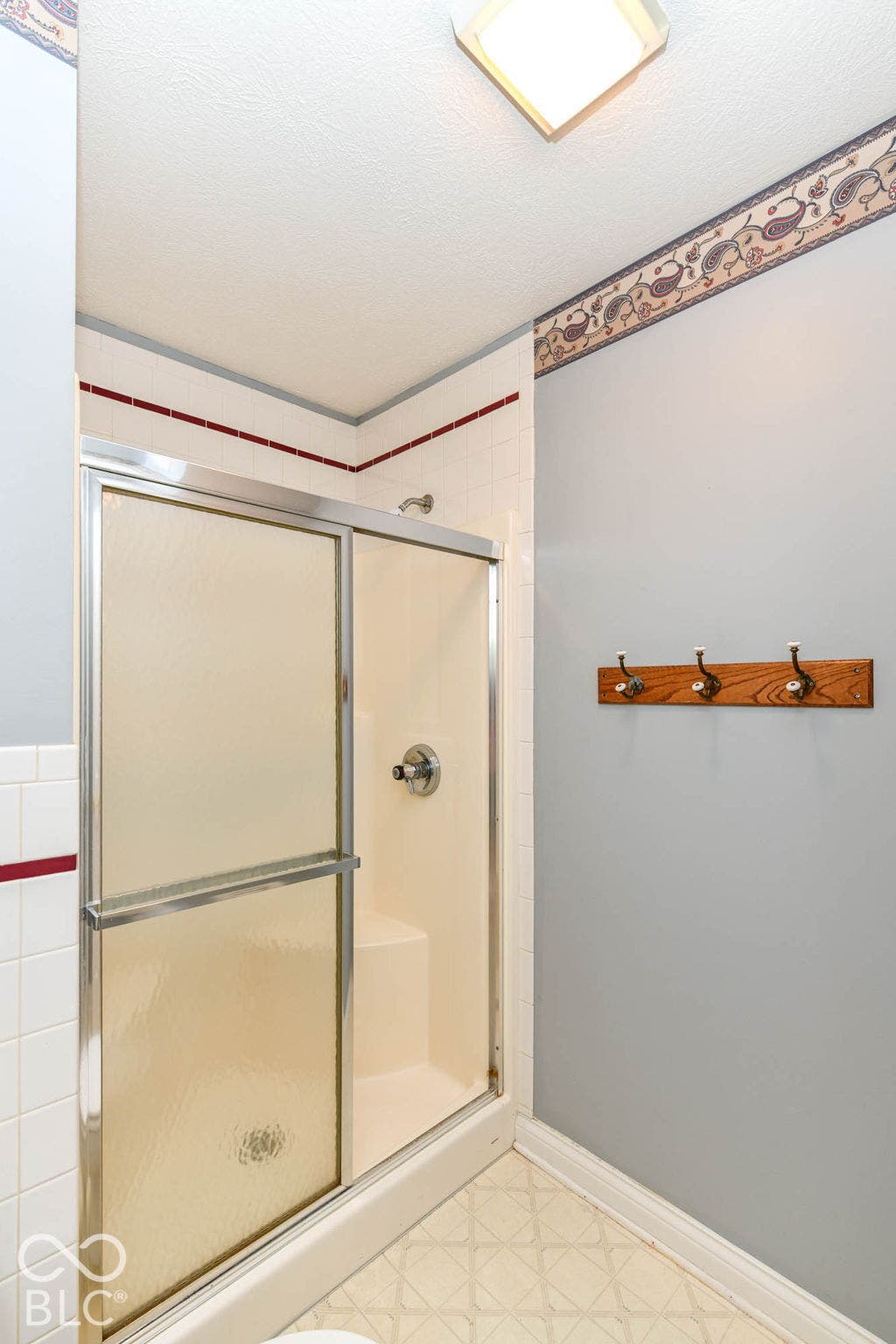 6431 Shamel Drive, Indianapolis, IN 46278 Upper Full Bathroom. Shower enclosure with sliding glass doors, chrome fixtures, and a step-in shower pan