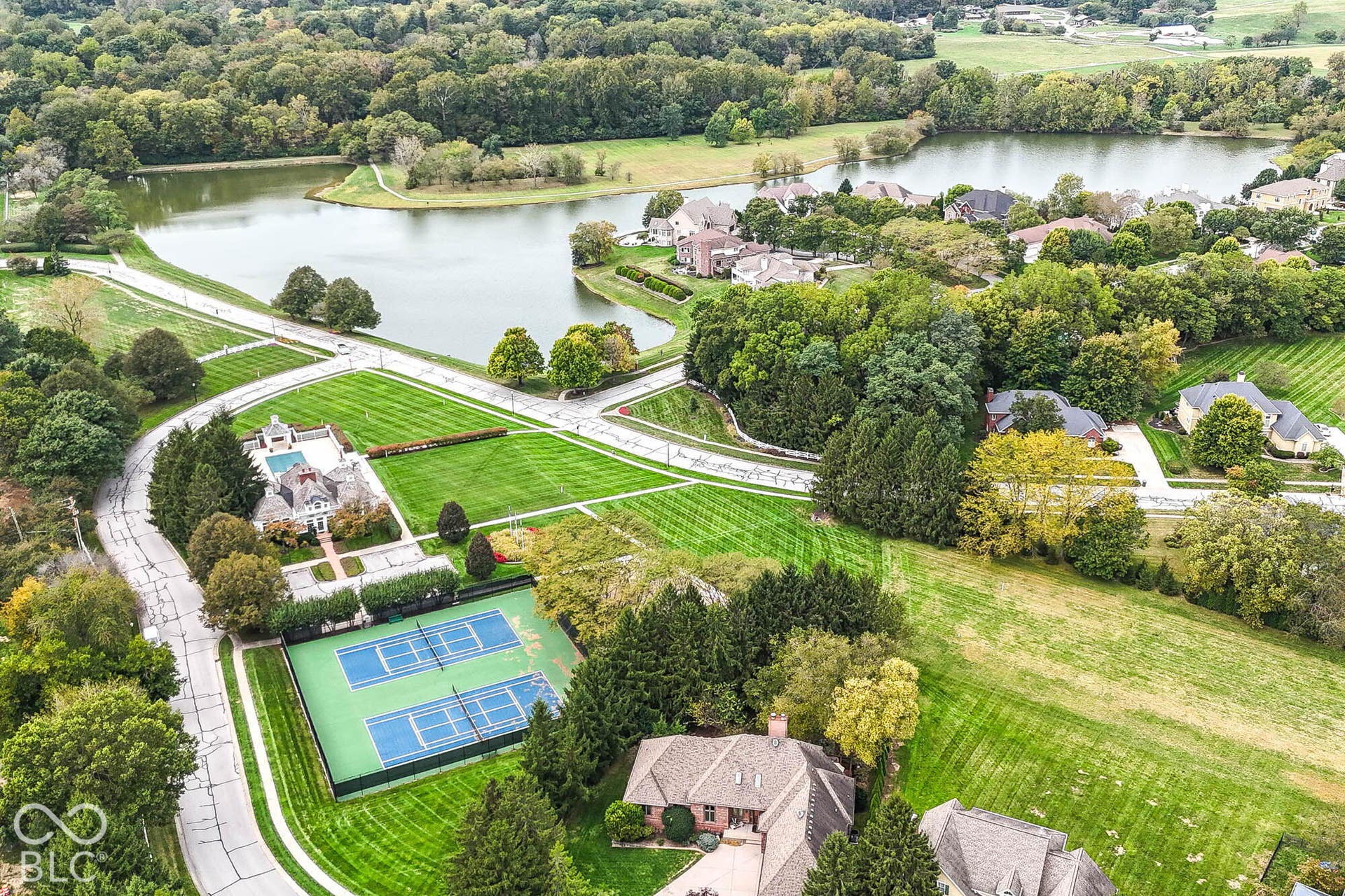 6431 Shamel Drive, Indianapolis, IN 46278 Aerial view of nearby expansive green space with clubhouse, tennis courts and swimming pool