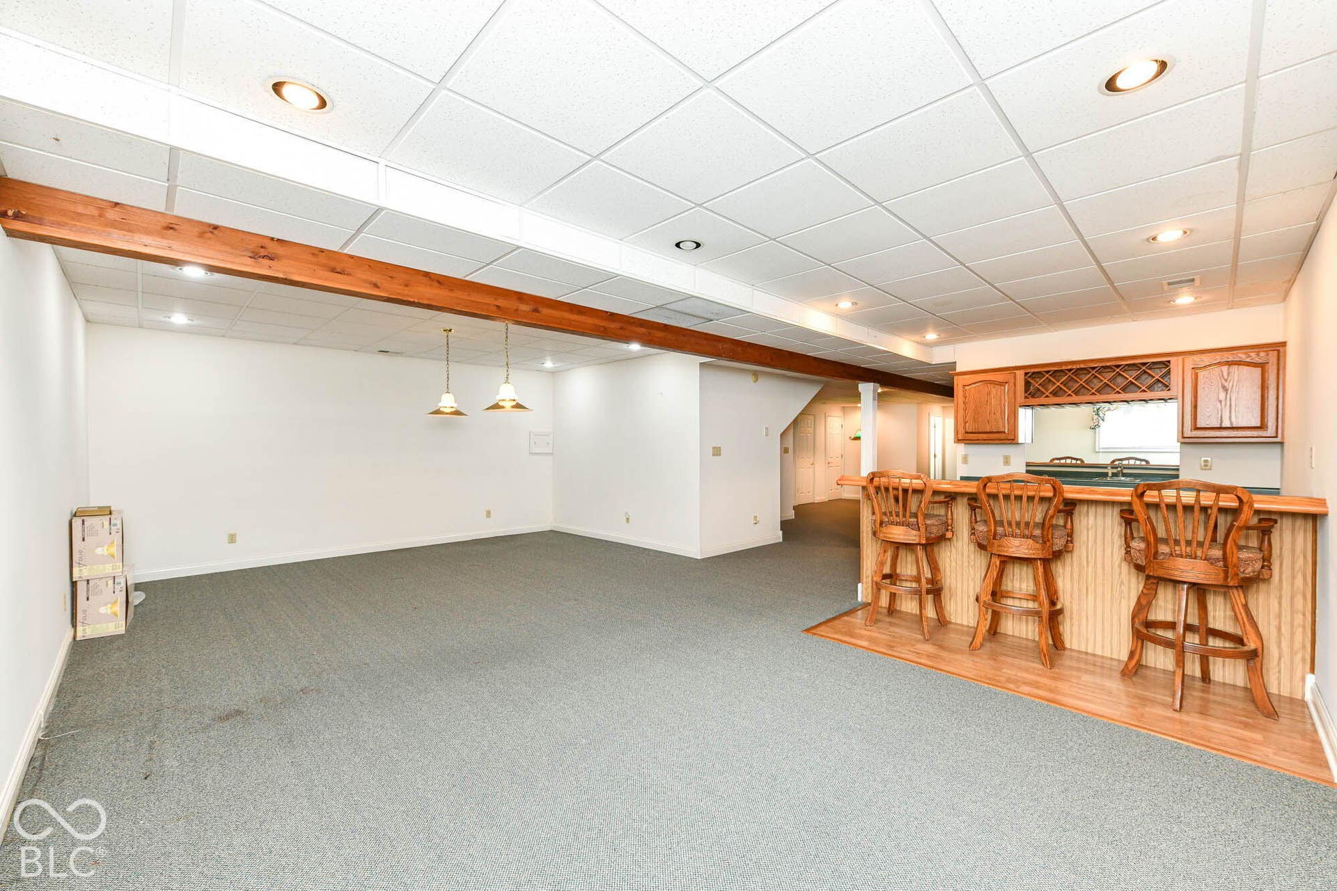 6431 Shamel Drive, Indianapolis, IN 46278 Built-in bar in Basement Rec Room. Wood-finish wet bar with integrated wine rack and cabinetry