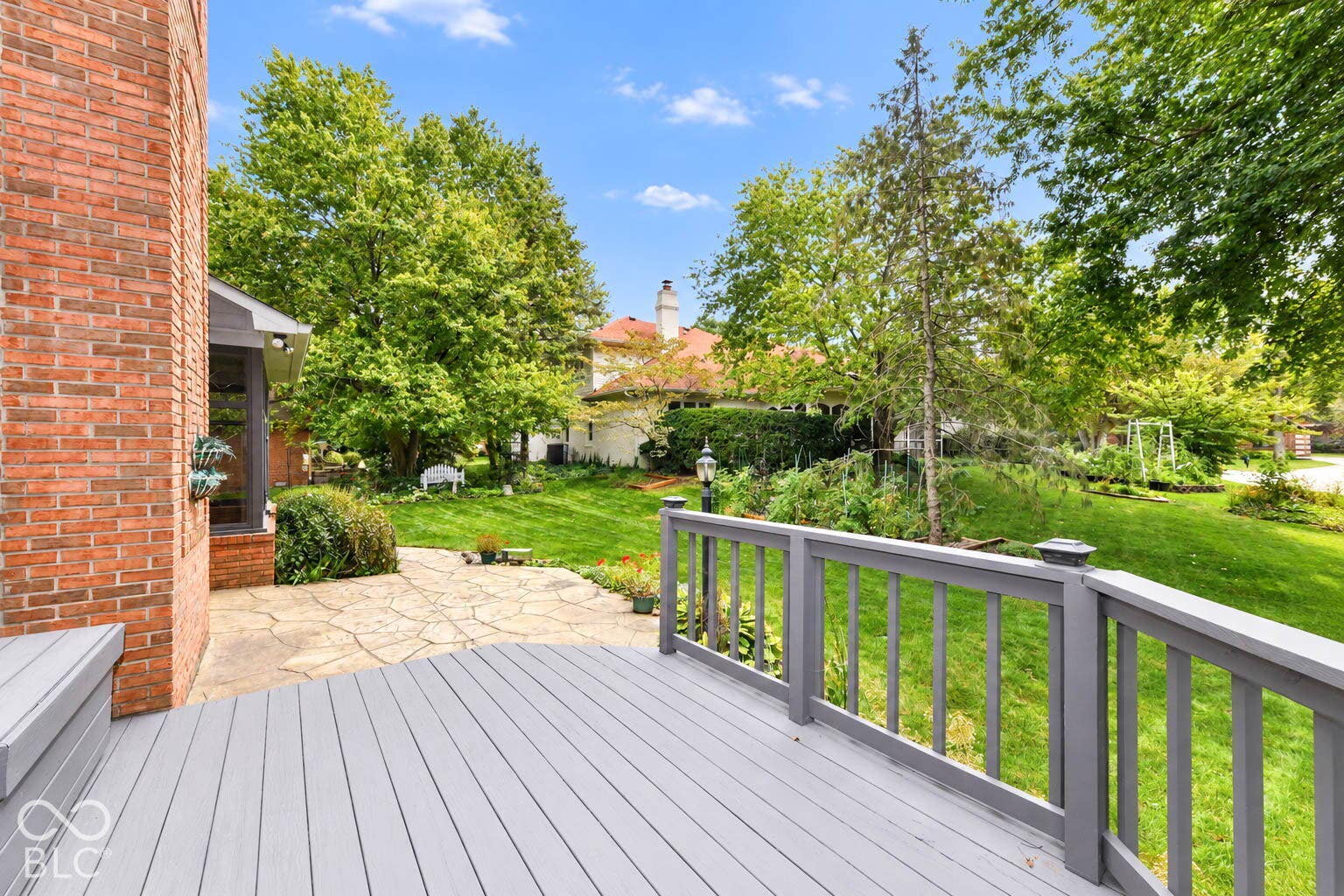 6431 Shamel Drive, Indianapolis, IN 46278 Spacious rear wood deck, stone patio and mature trees