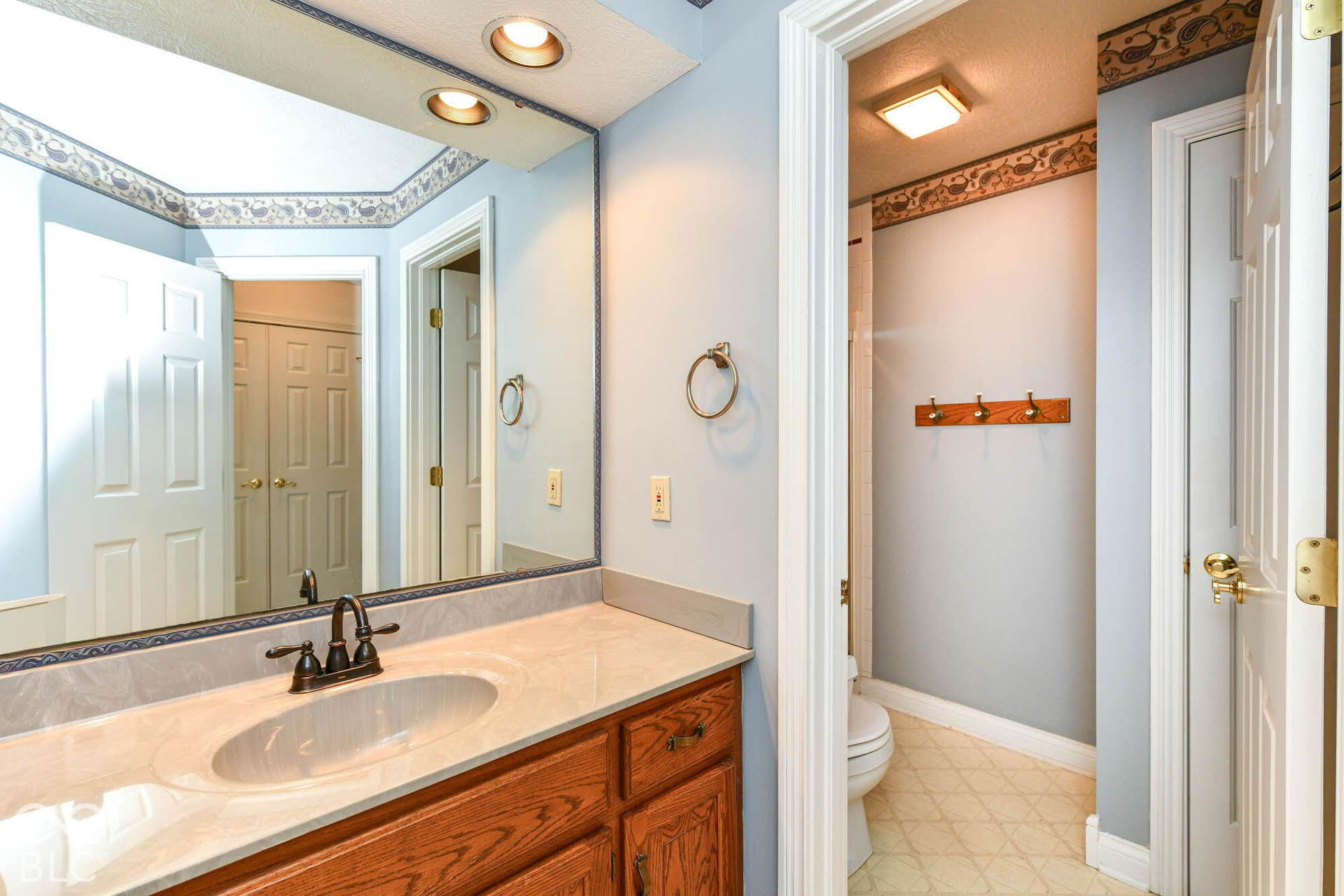 6431 Shamel Drive, Indianapolis, IN 46278 Upper Full Bathroom. Wood-finish vanity with an integrated sink and bronze-finish faucet
