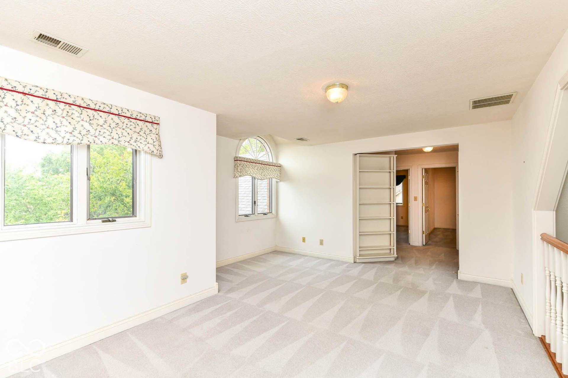 6431 Shamel Drive, Indianapolis, IN 46278 Loft. Expansive carpeted room overlooking the Great Room with multiple windows and a built-in bookshelf