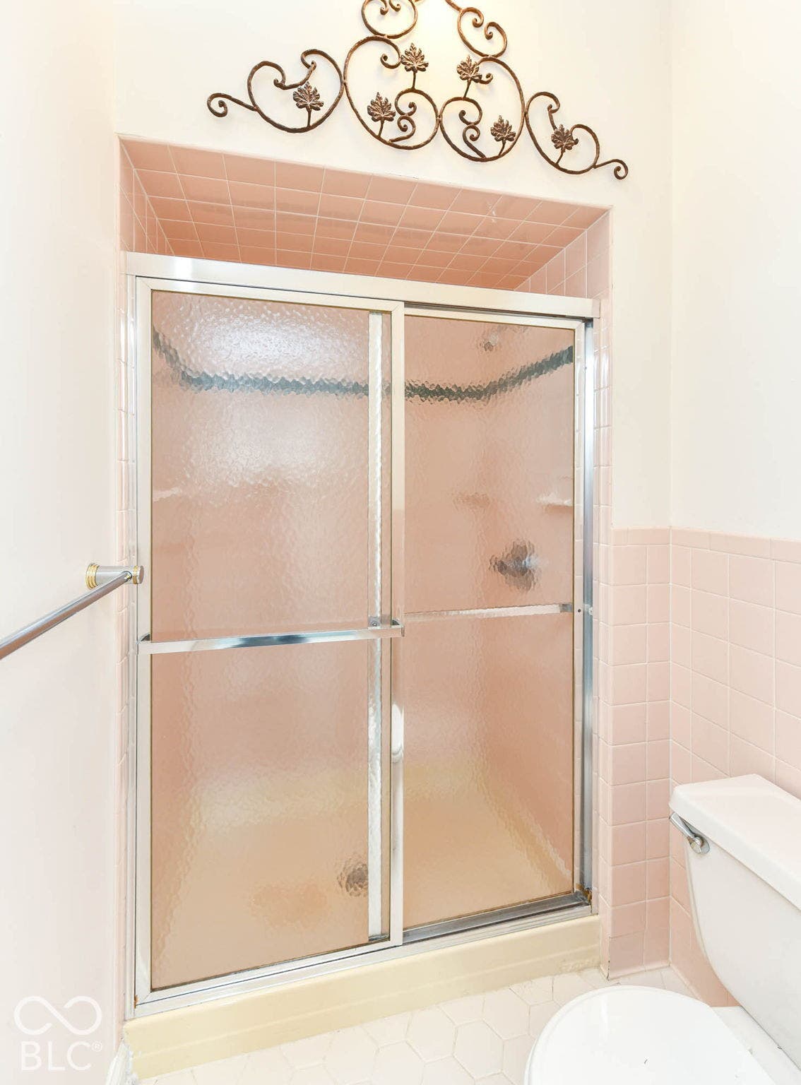 6431 Shamel Drive, Indianapolis, IN 46278 Primary Bathroom shower with sliding frosted glass doors, pink ceramic wall tile