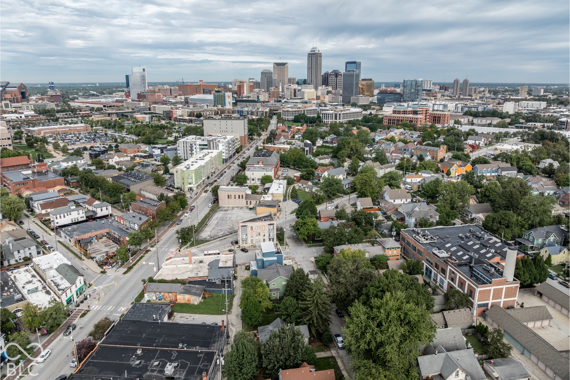 Aerial perspective showcasing a dense urban core with a mix of commercial and residential structures
