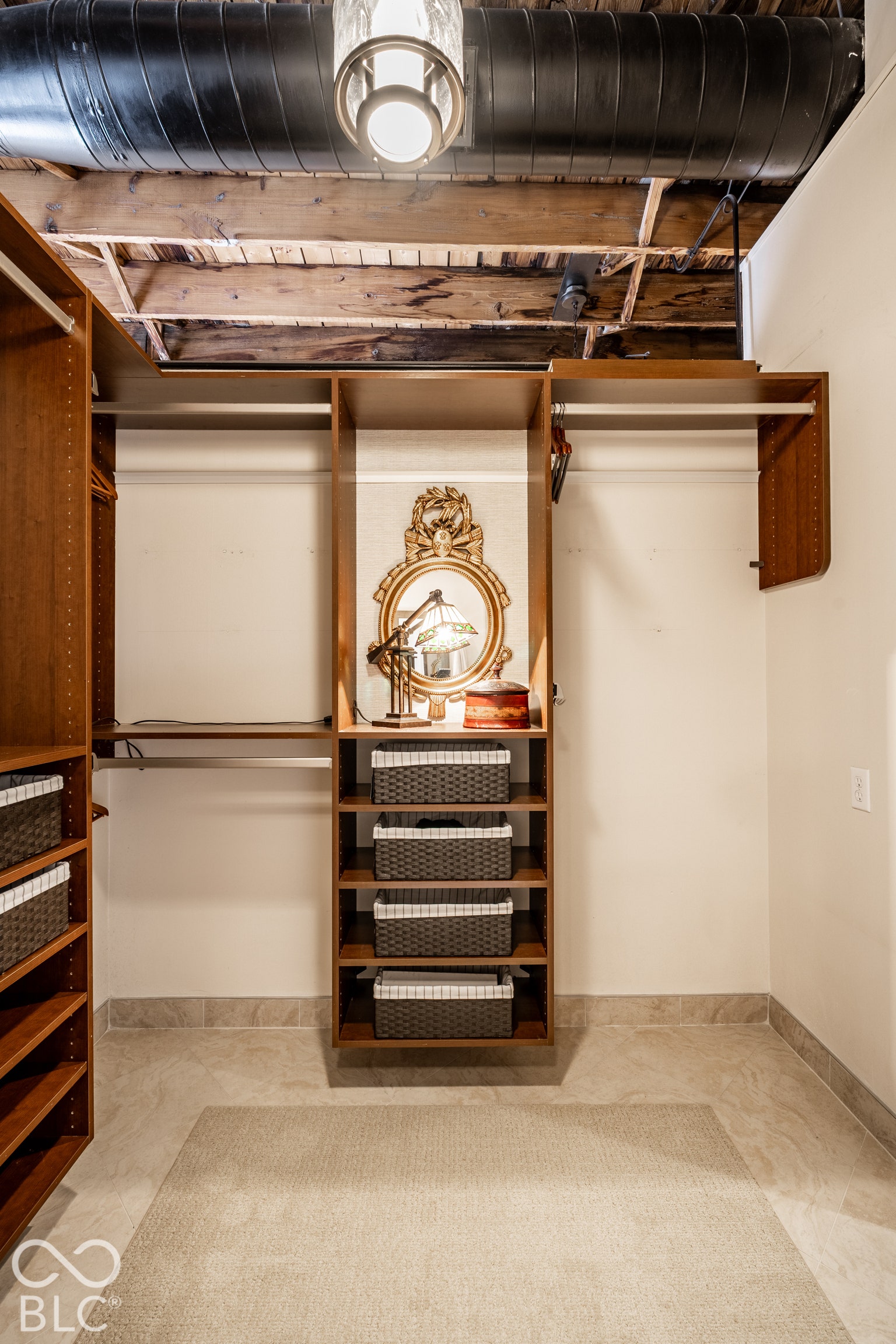 Built-in closet organization system with shelving and hanging rods