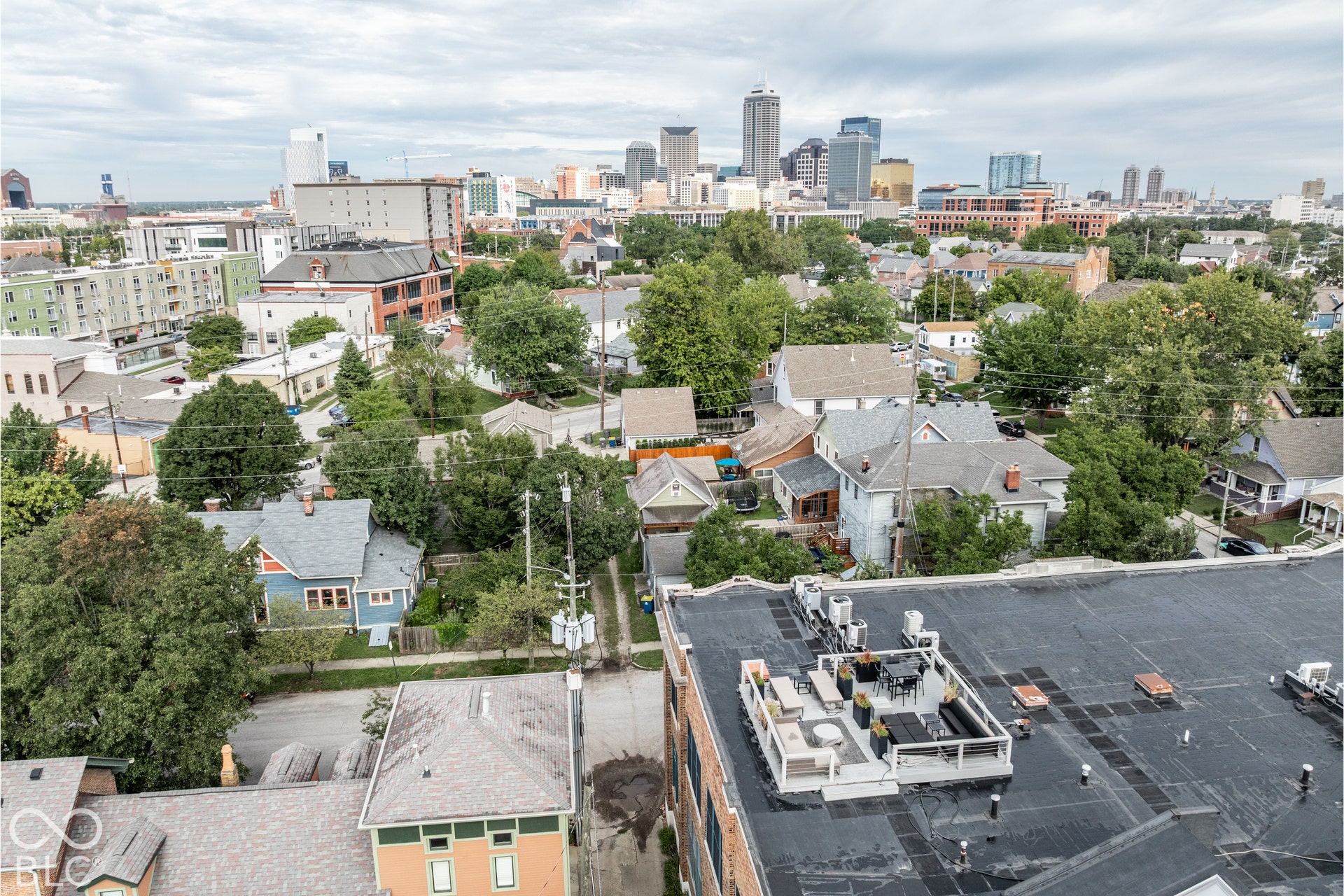 Rooftop deck featuring multiple seating arrangements and a dining area