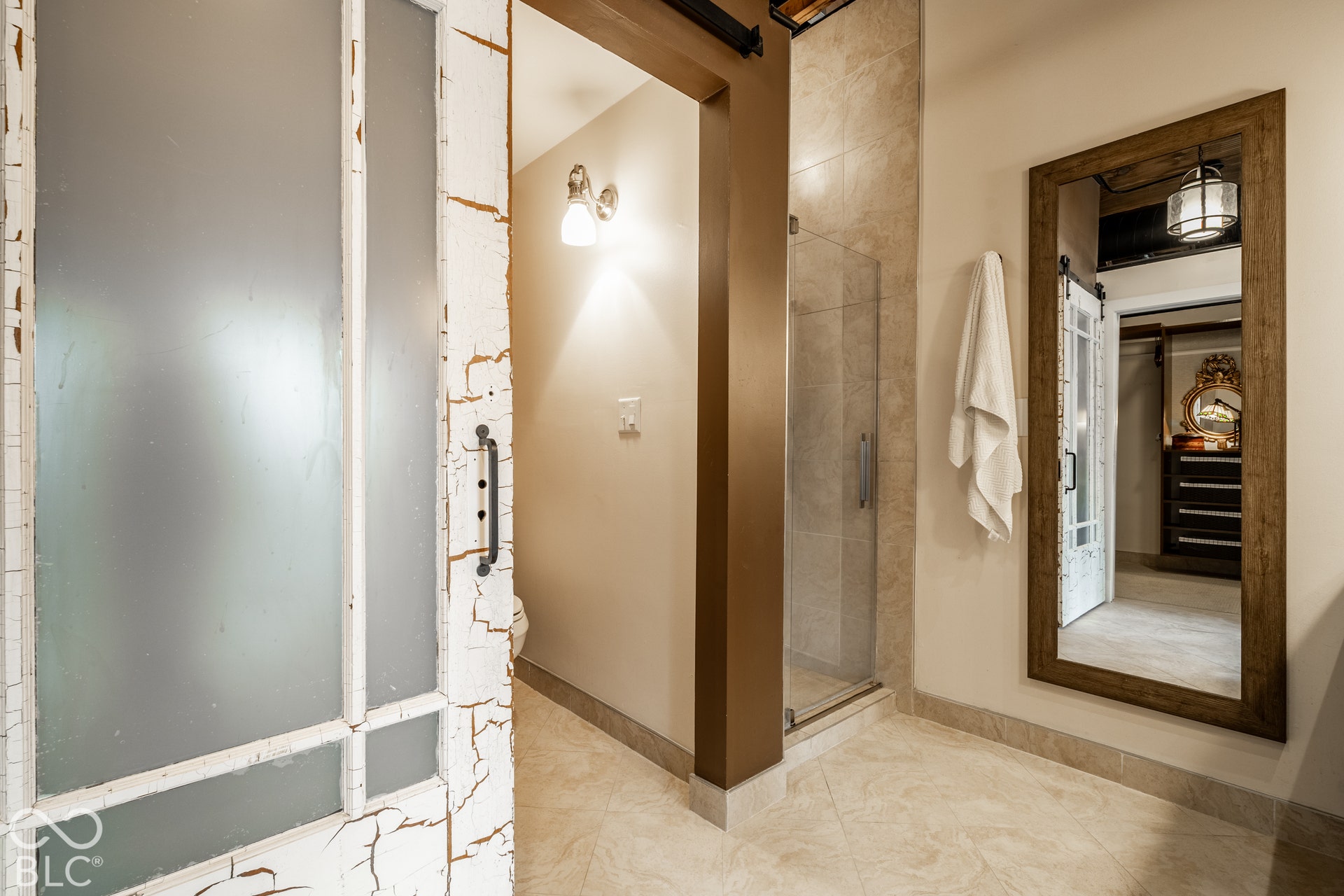 Frosted glass barn door with distressed white finish