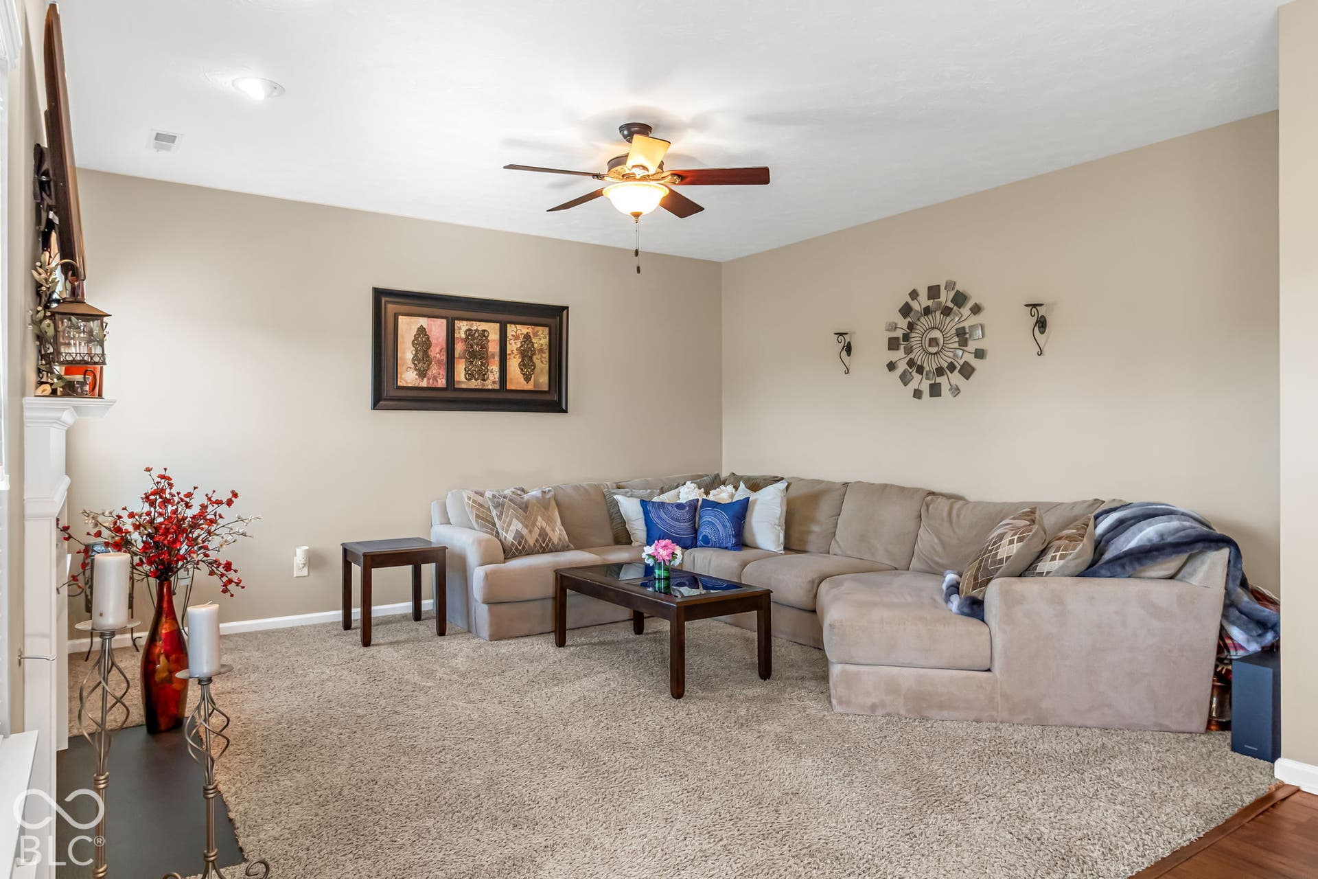 Recessed lighting, ceiling fan with integrated lighting, neutral wall paint, and carpeted flooring