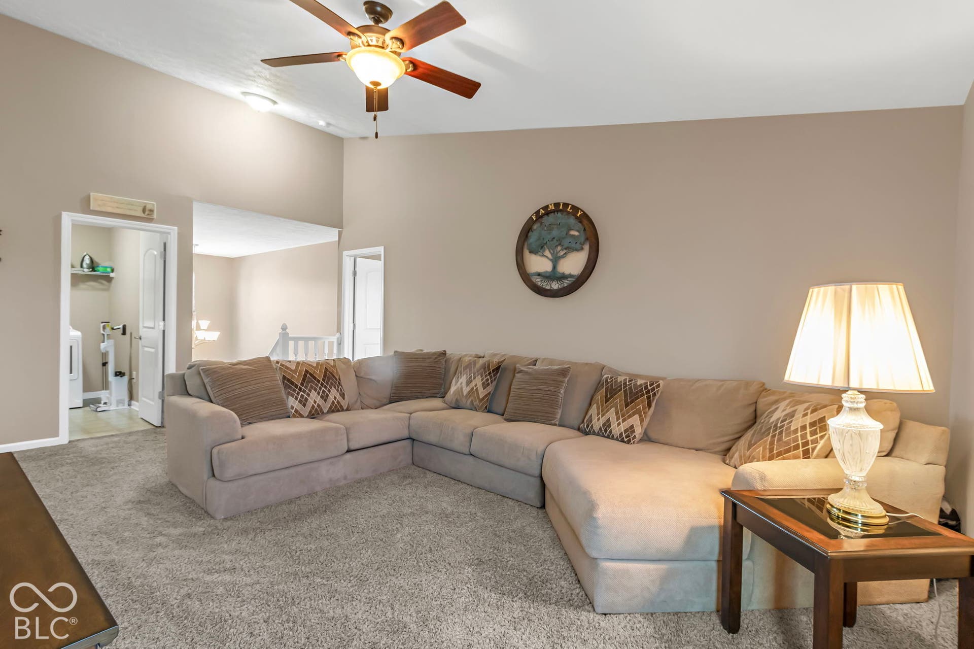 Vaulted ceiling with a ceiling fan, recessed lighting, and neutral wall paint
