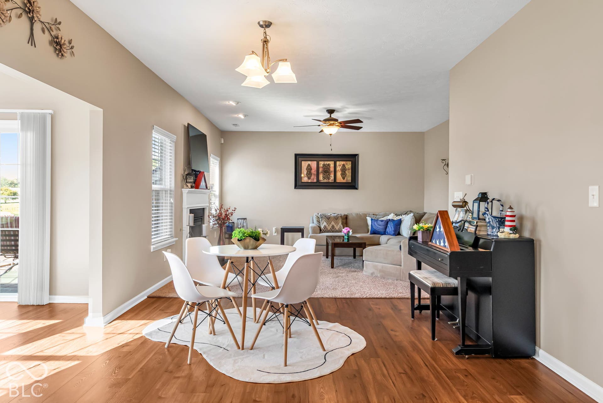Wood-finish flooring throughout, recessed lighting, and a ceiling fan