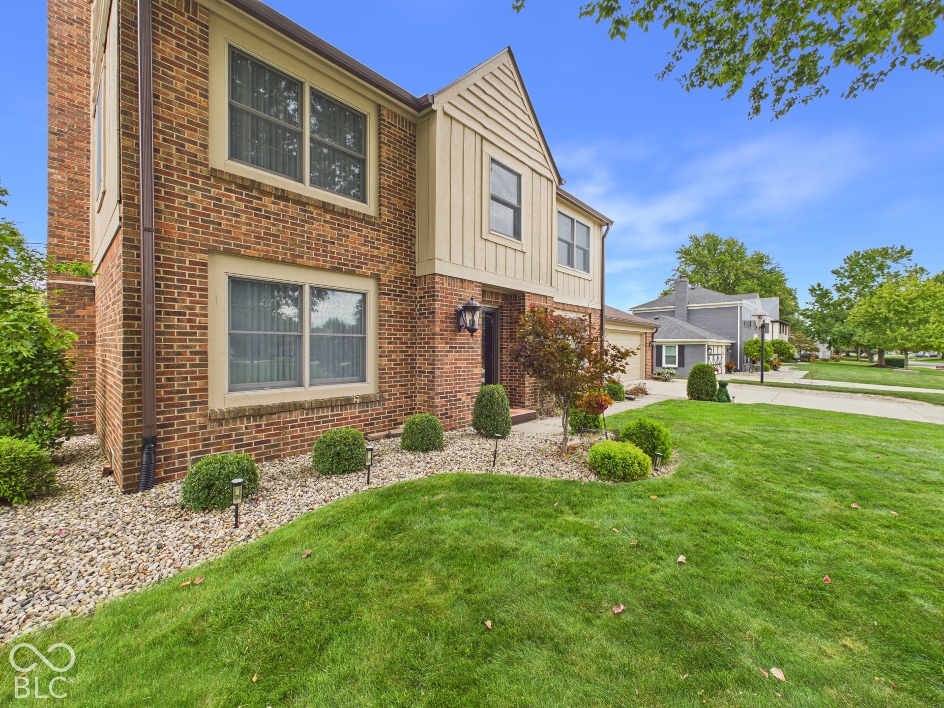 Brick exterior with wood siding accents