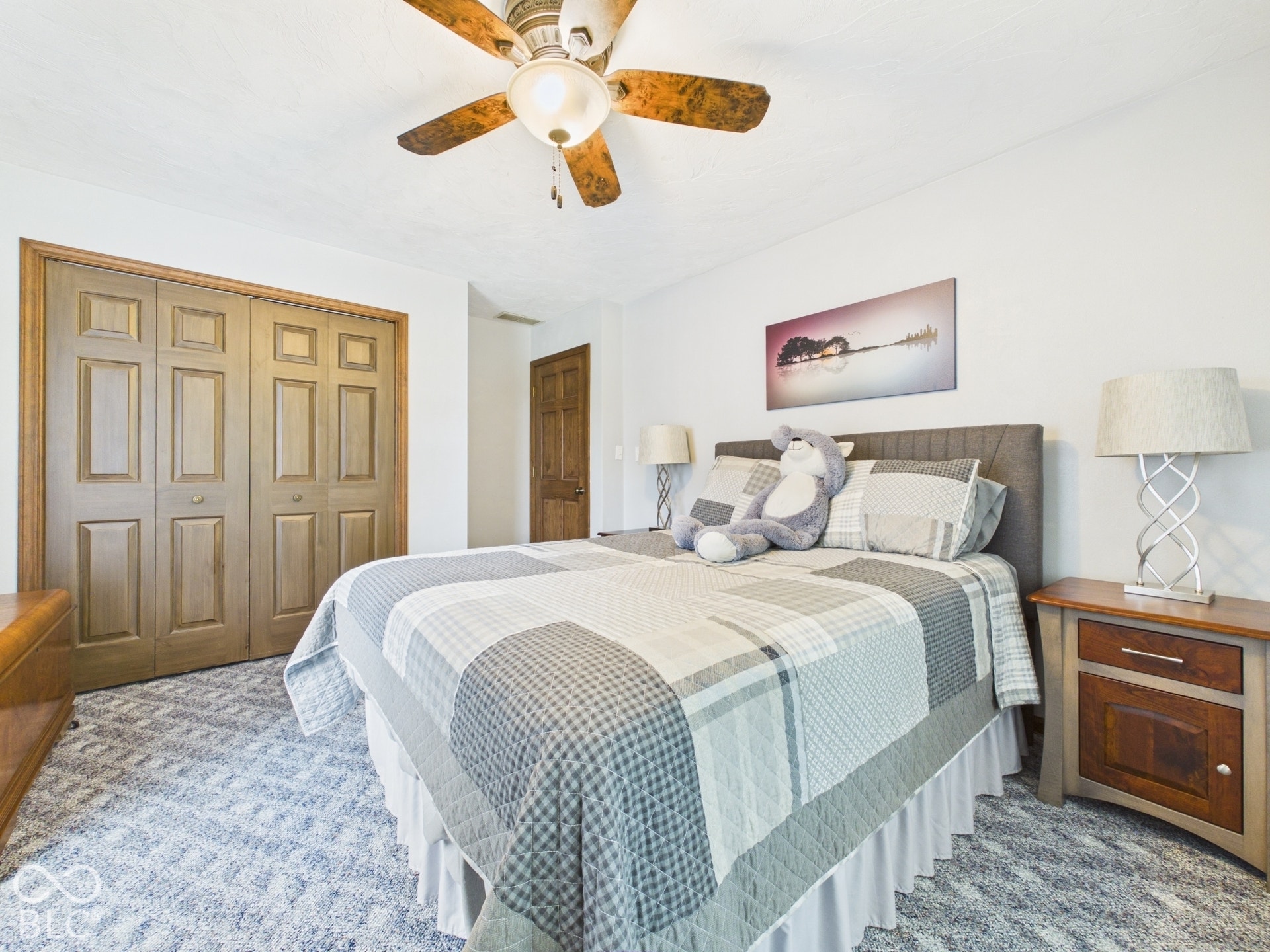 Recessed lighting, ceiling fan with wood-finish blades, and wood-finish panel doors