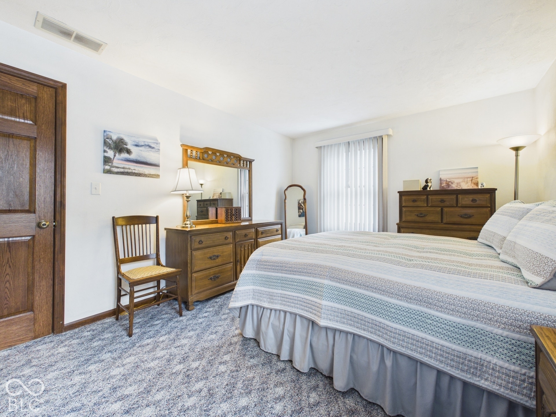 White painted walls complemented by wood-finish doors and trim
