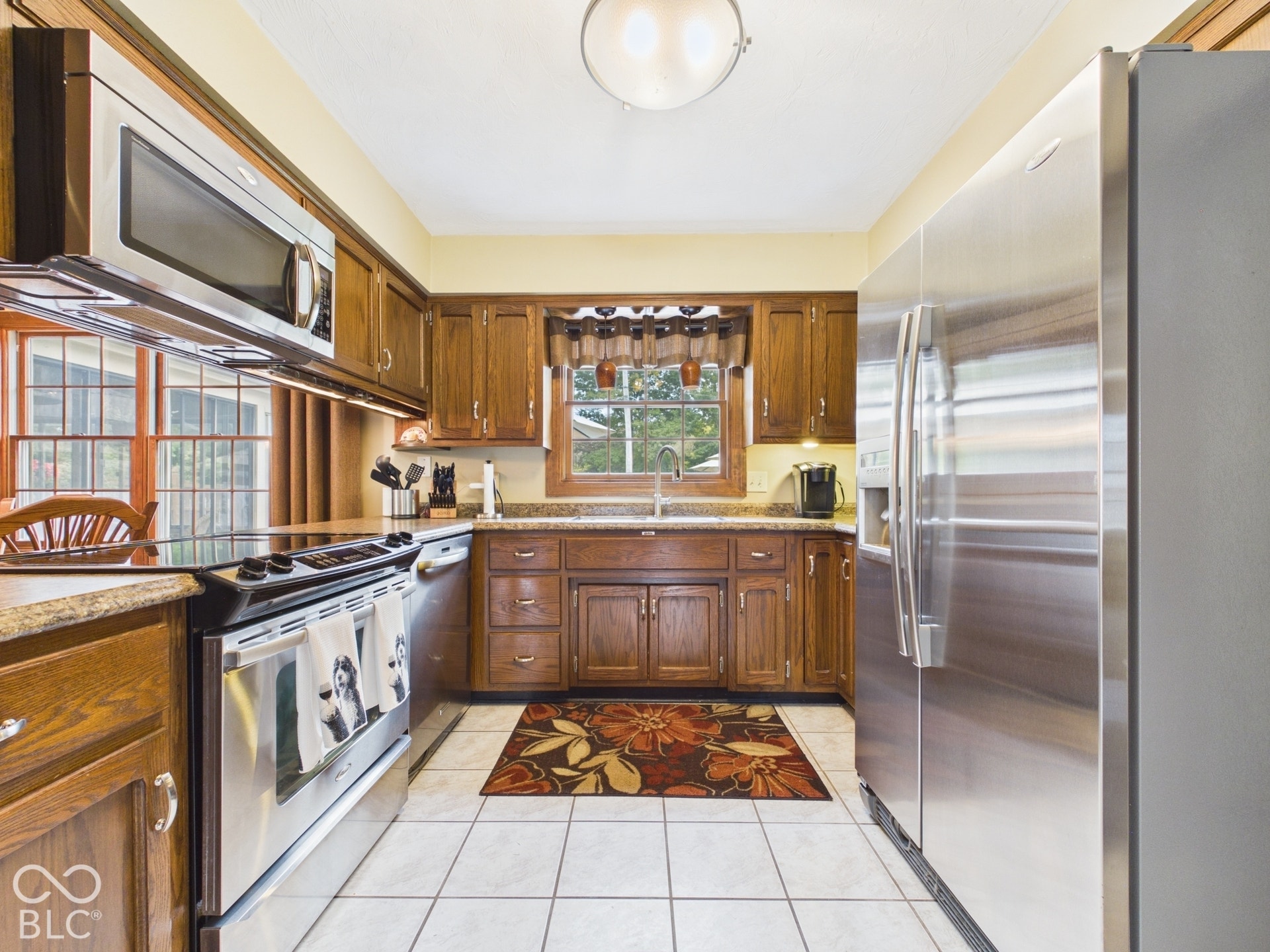 Wood-finish cabinetry paired with light-toned countertops