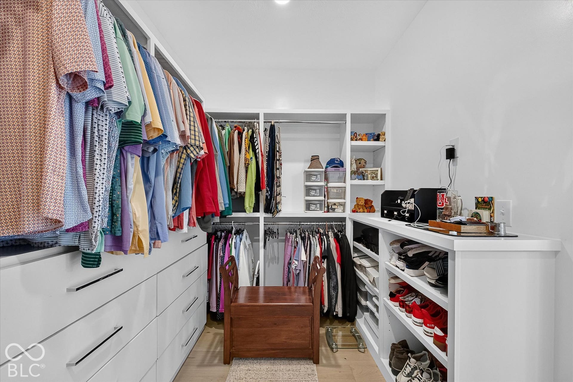 1405 Lake Haven Lane, Westfield, IN 46074 Custom closet system featuring extensive built-in cabinetry, shelving, and hanging rods