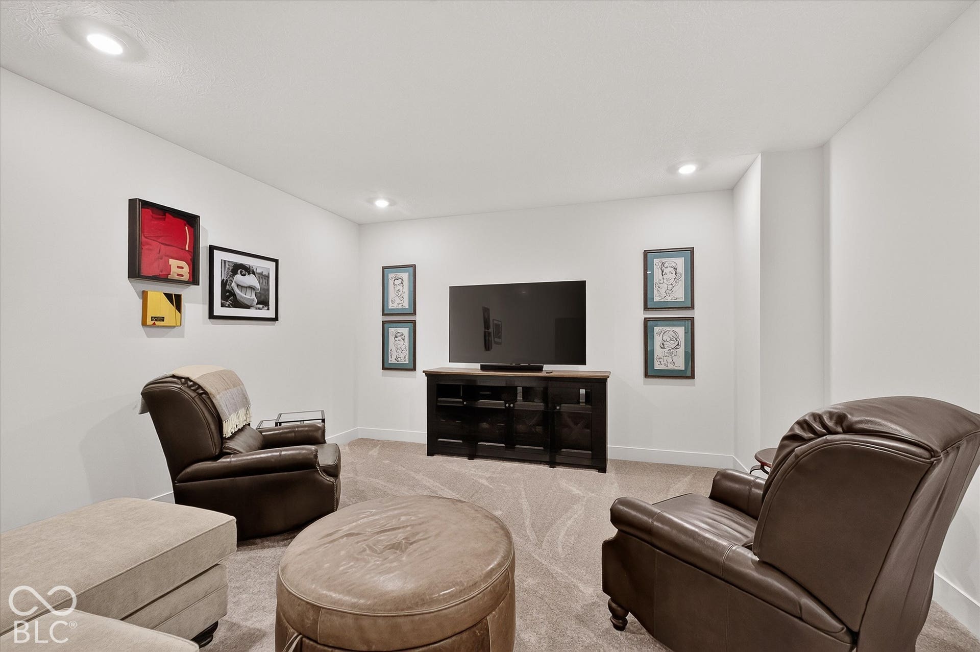 1405 Lake Haven Lane, Westfield, IN 46074 Recessed lighting illuminates the room, featuring a built-in media console with a wood-finish top and dark cabinetry, set against light-colored walls and carpeted flooring