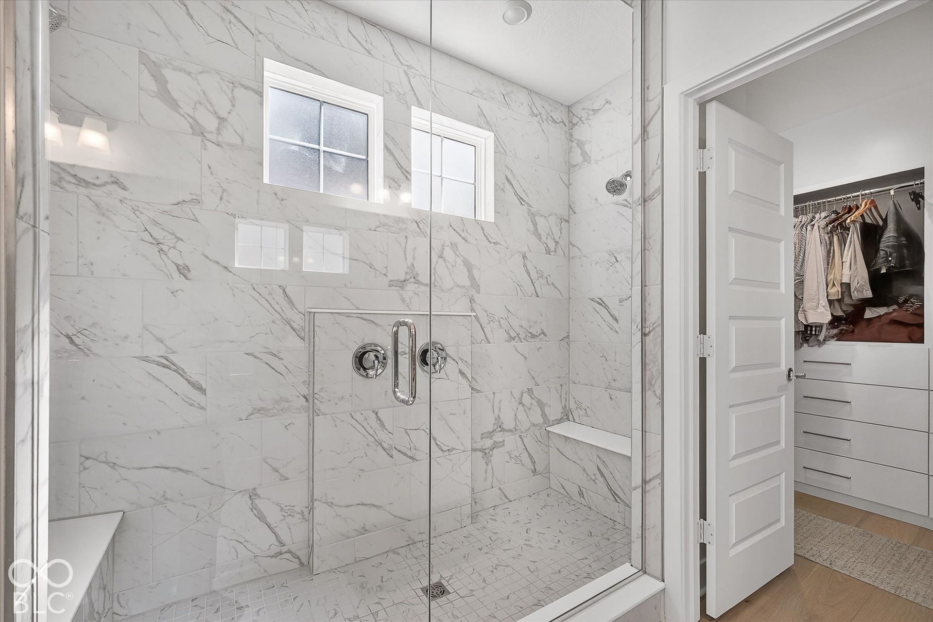 1405 Lake Haven Lane, Westfield, IN 46074 Walk-in shower with full-height tile, two integrated benches, and a glass enclosure