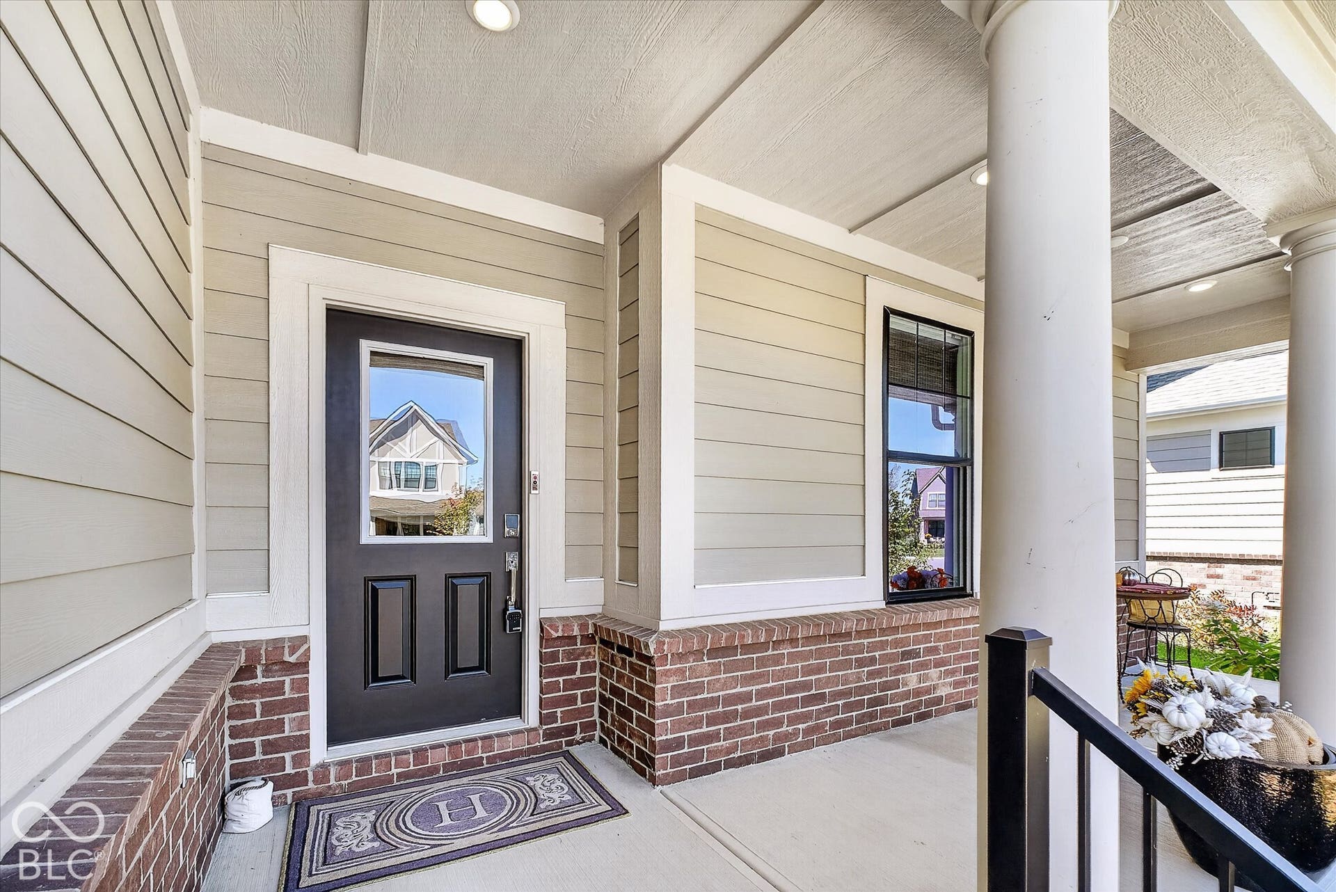 1405 Lake Haven Lane, Westfield, IN 46074 Covered front porch featuring brick detailing and siding