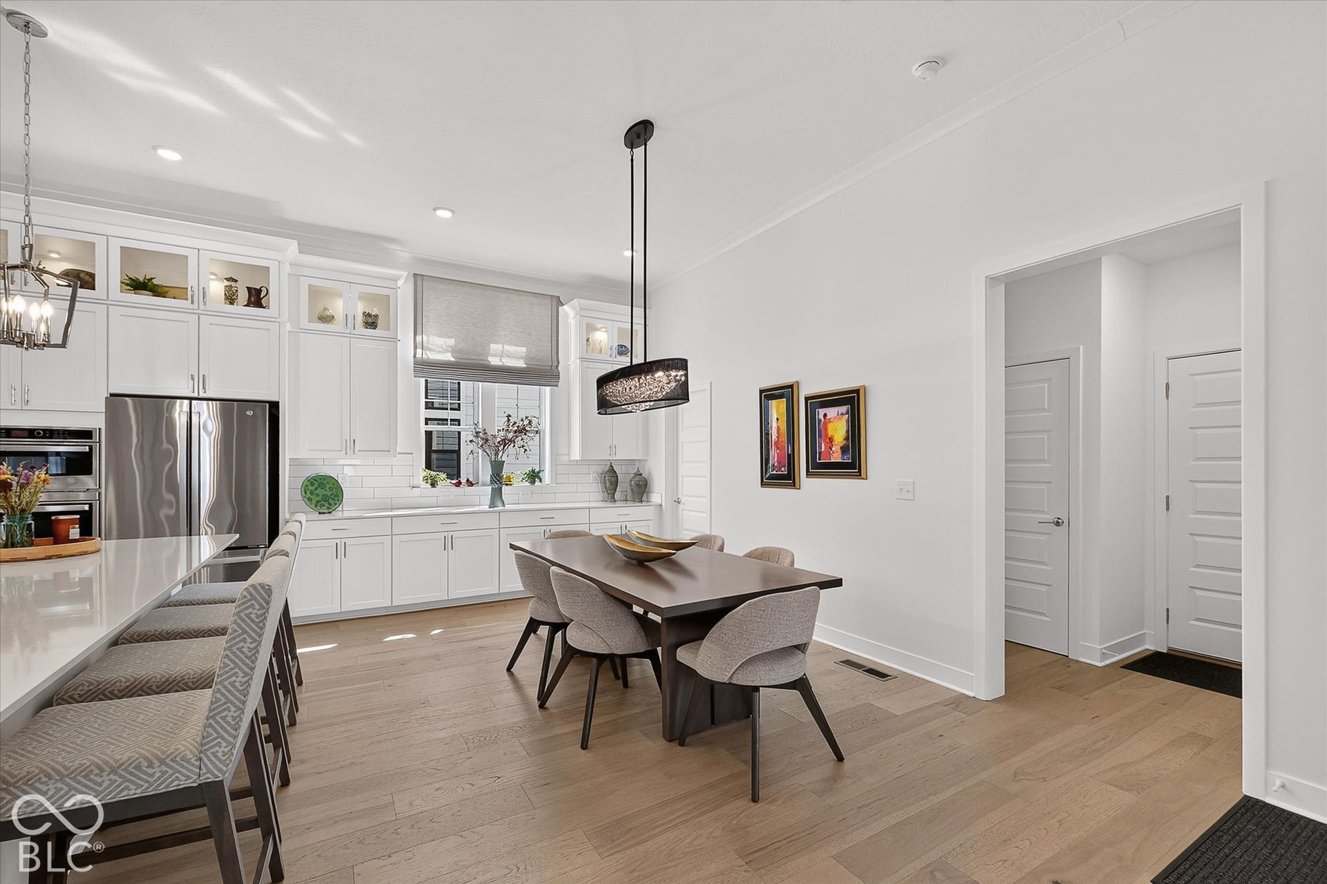 1405 Lake Haven Lane, Westfield, IN 46074 Gourmet kitchen featuring white shaker cabinetry, stainless steel appliances, and a subway tile backsplash