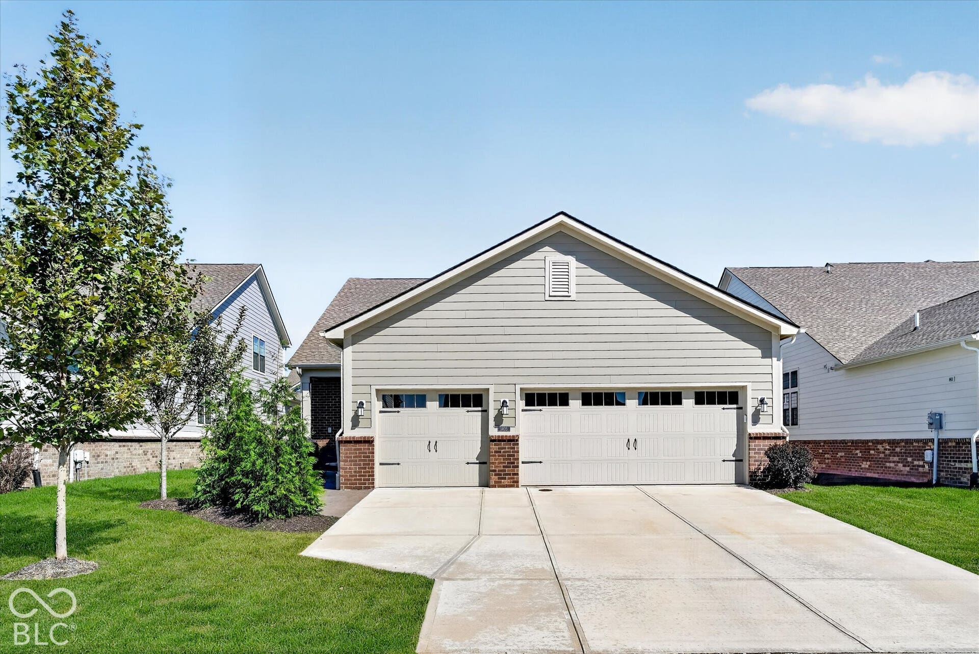1405 Lake Haven Lane, Westfield, IN 46074 Two-car garage with overhead doors and transom windows