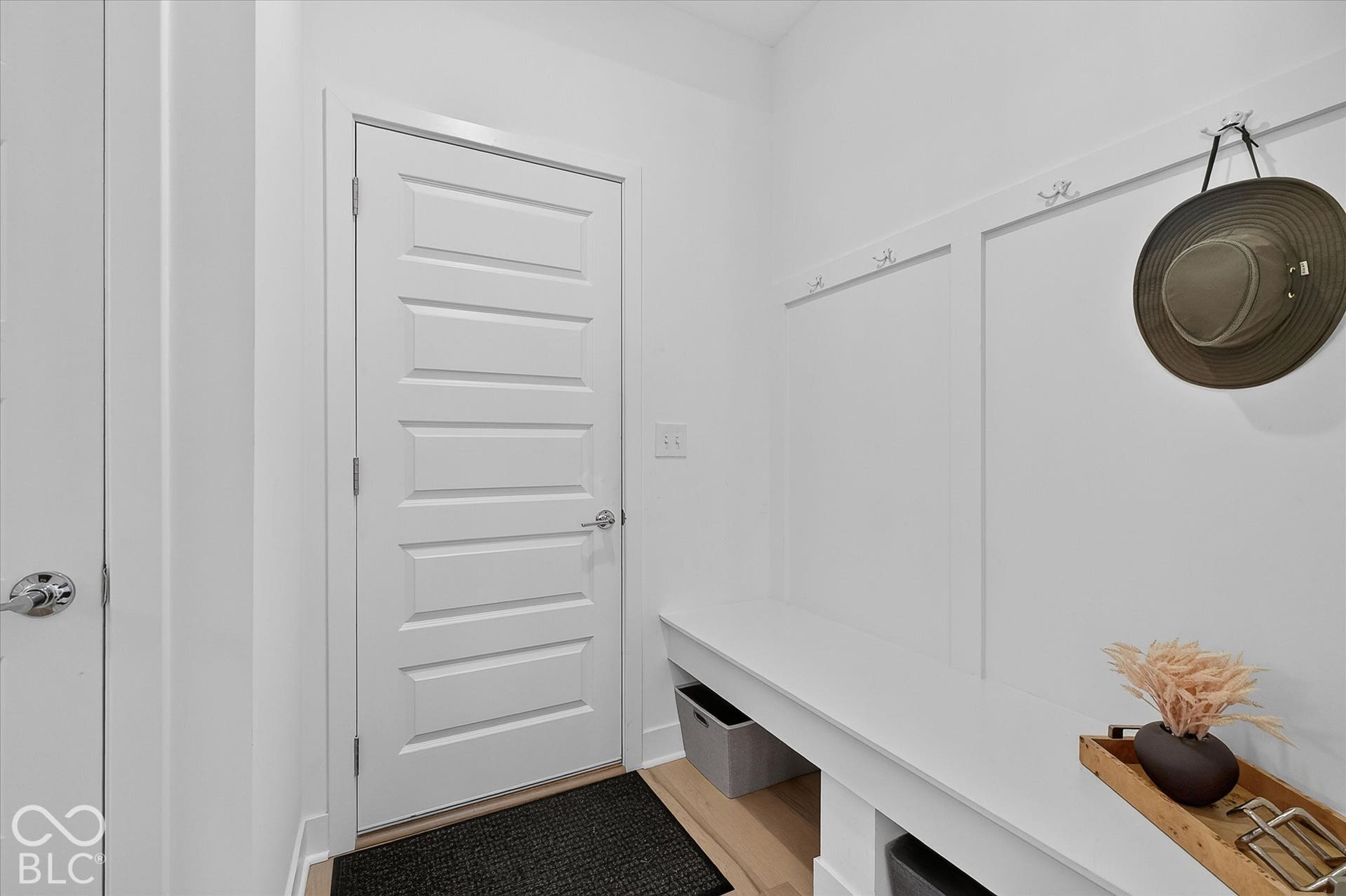 1405 Lake Haven Lane, Westfield, IN 46074 Built-in bench seating with storage, integrated wall paneling, and wall-mounted hooks