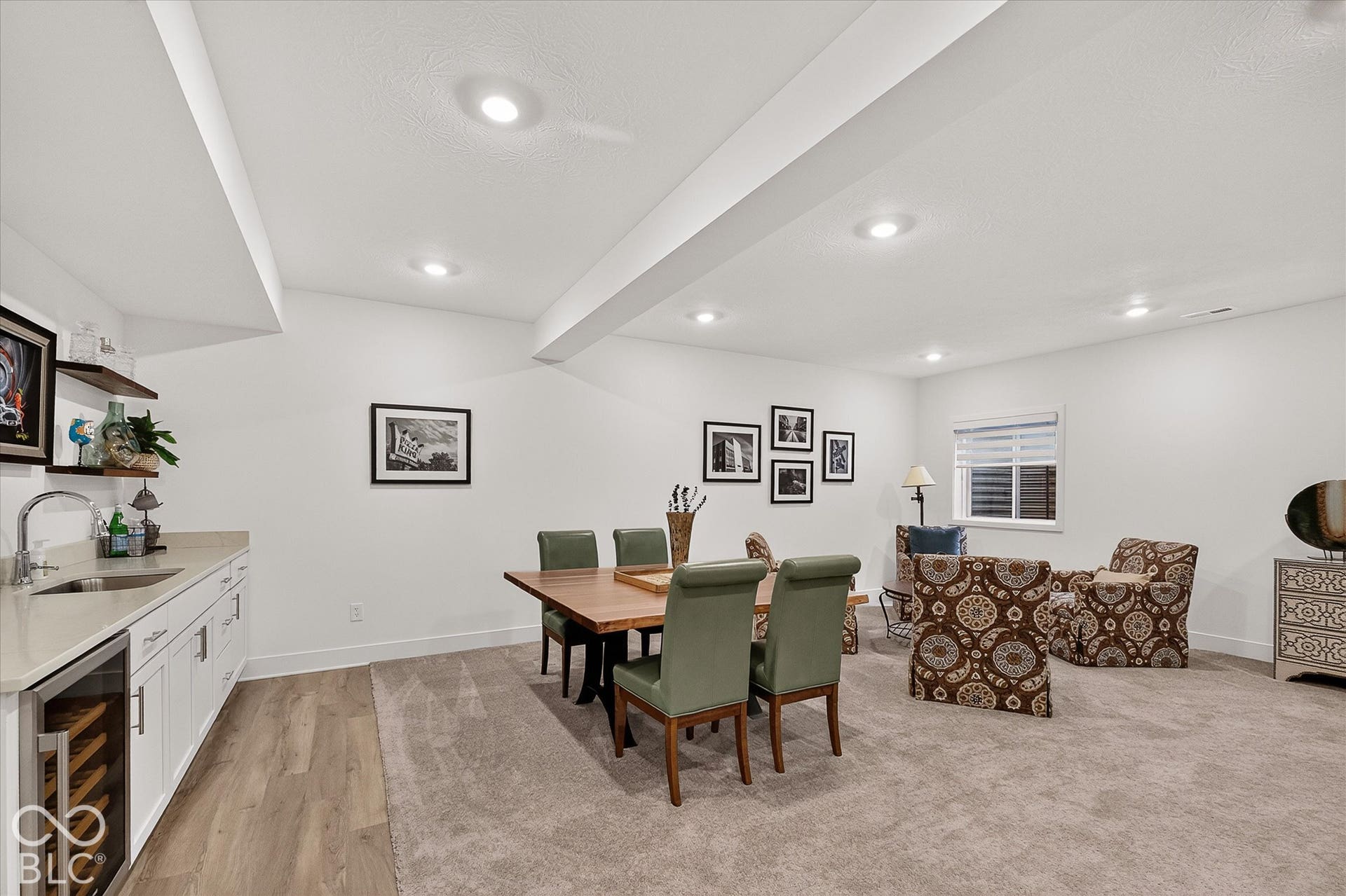 1405 Lake Haven Lane, Westfield, IN 46074 Recessed lighting, built-in wet bar with sink, white cabinetry with under-counter wine refrigerator, wood-finish flooring, and wall-to-wall carpeting